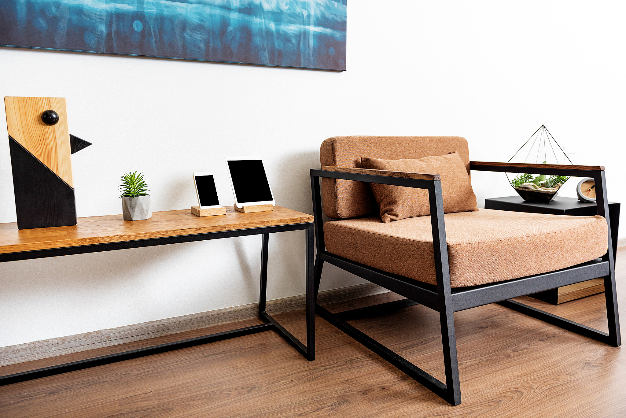 lounger with desk and small cabinet in light apartment