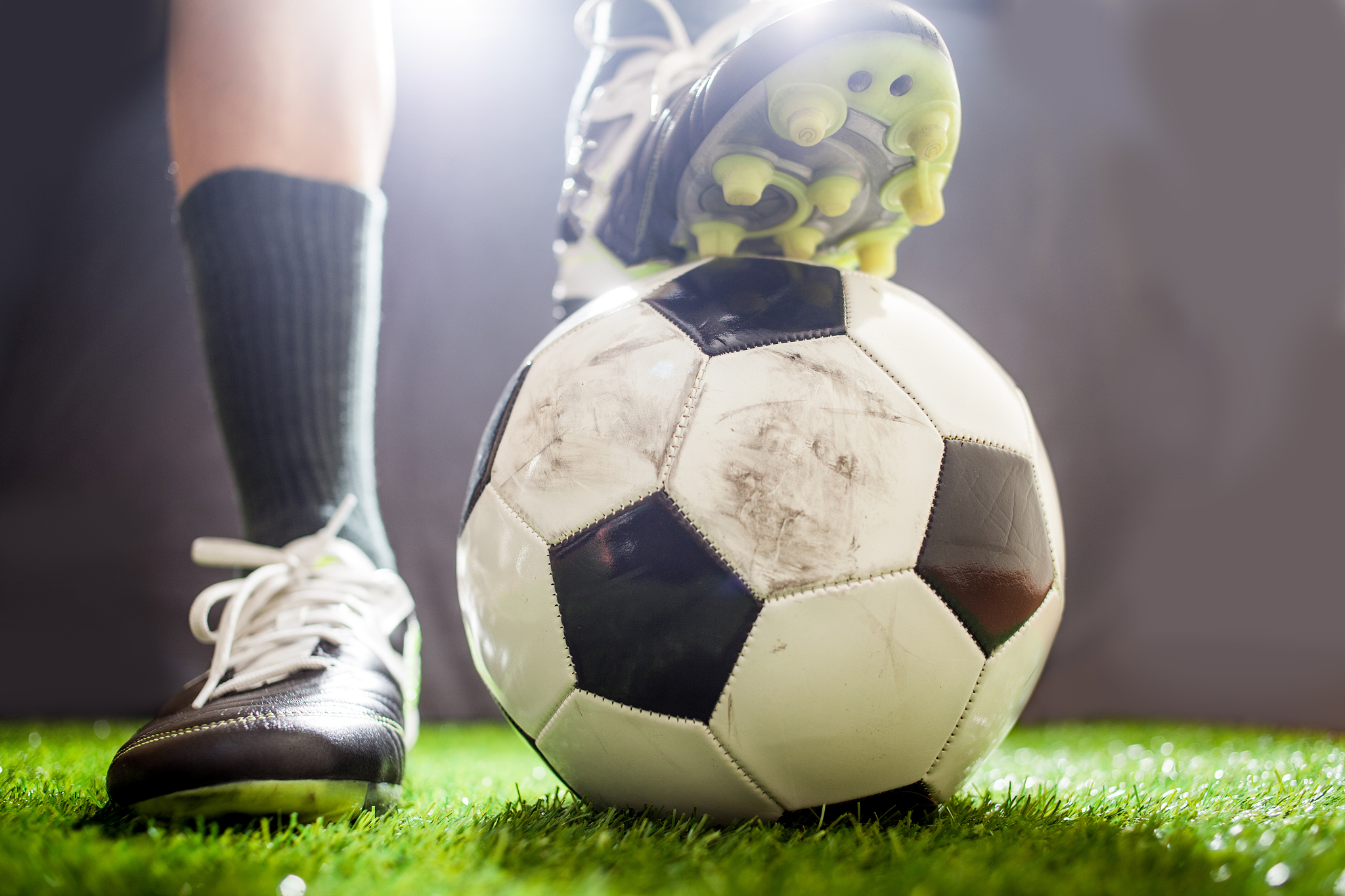 low angle view of player with soccer ball on field