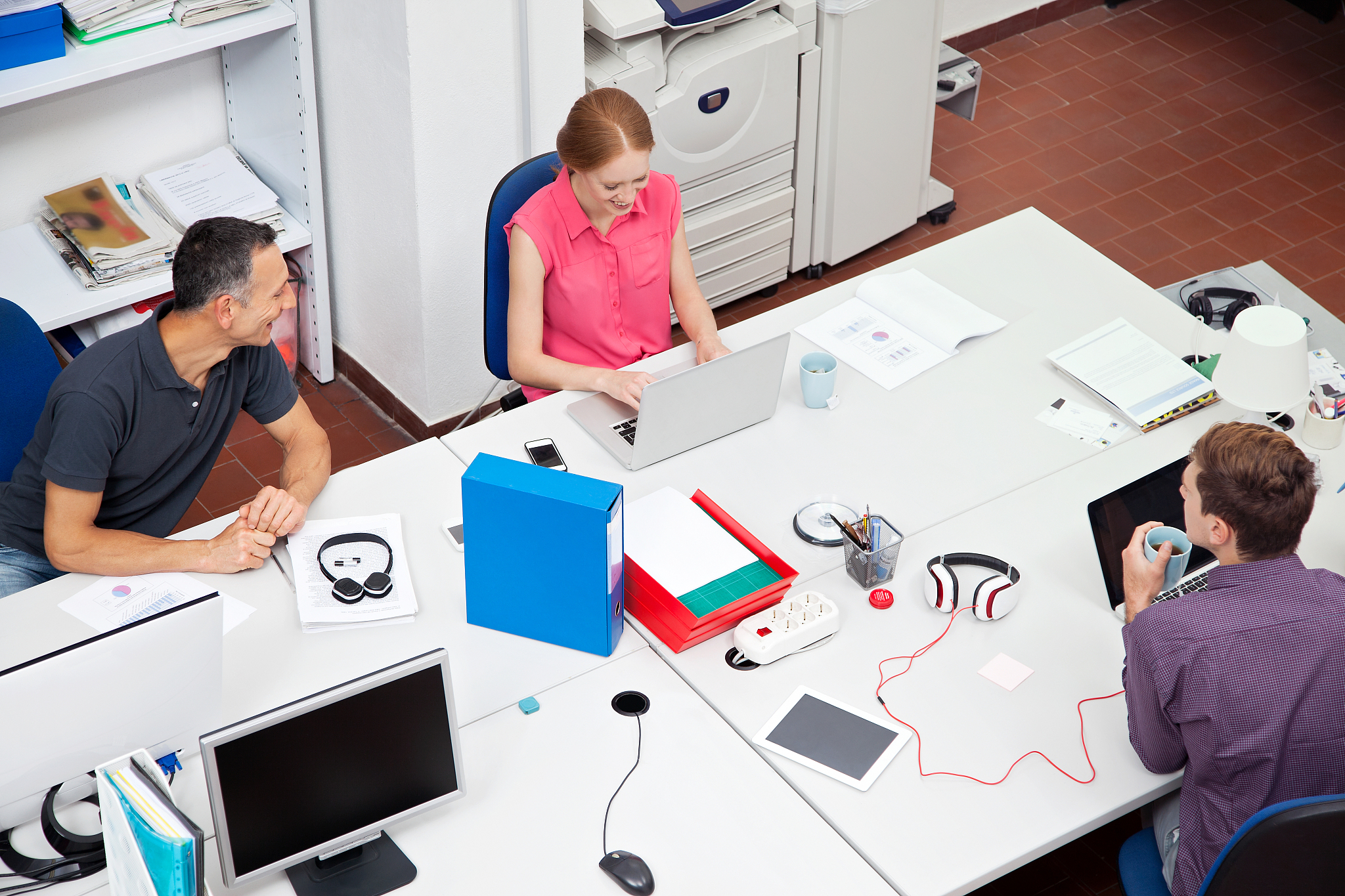 colleagues working in office, high angle