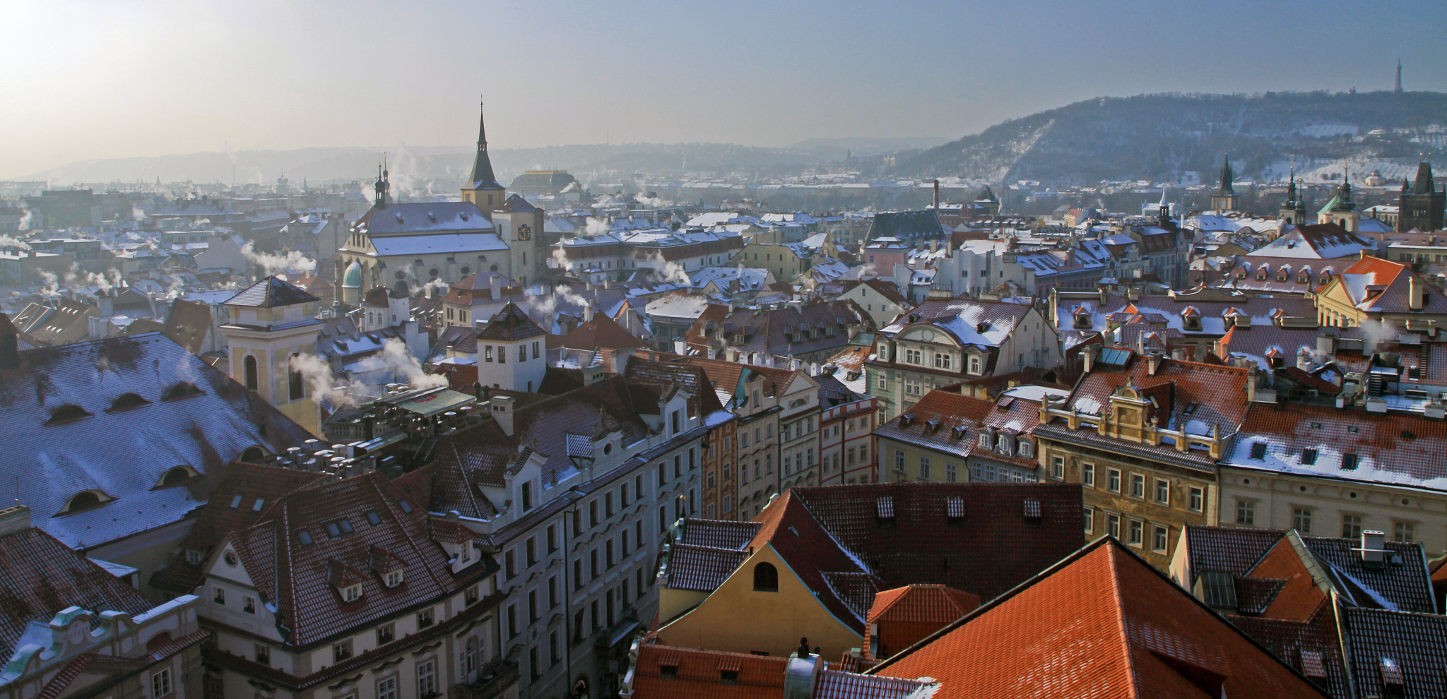 snowy roofs in prague