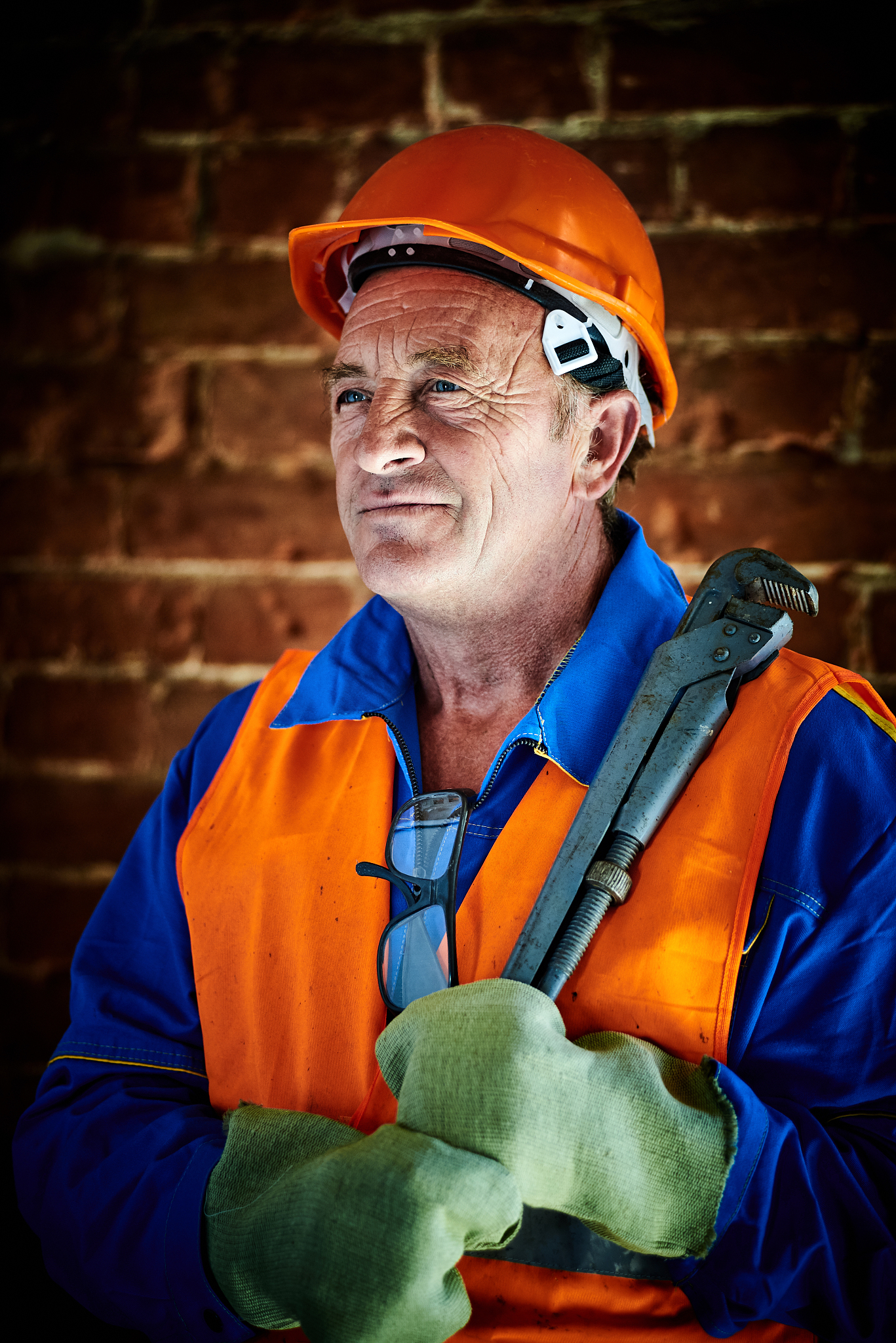 worker in factory carrying work tool