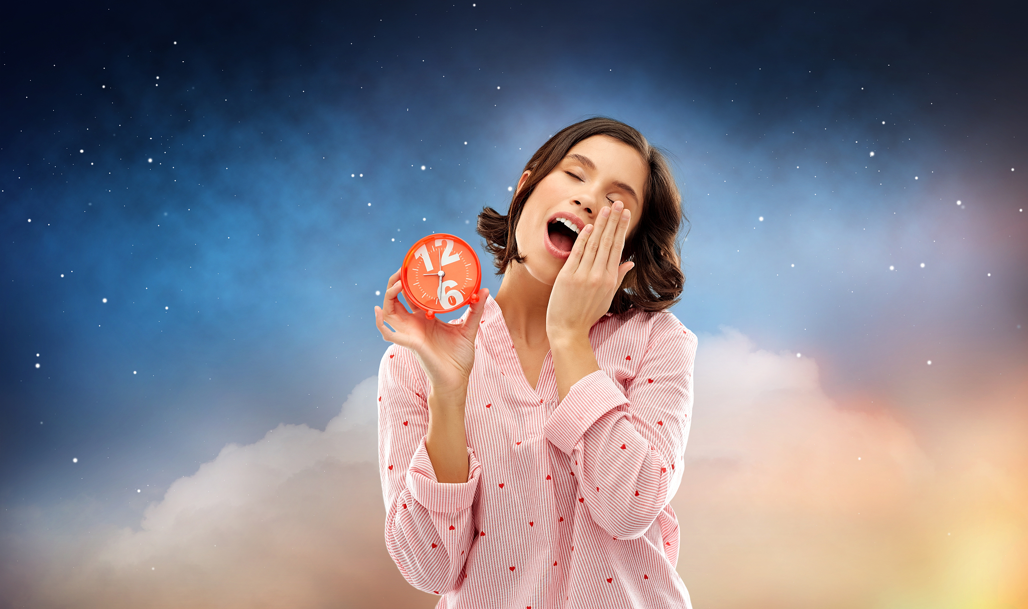 people and bedtime concept - sleepy young woman in pajama with a