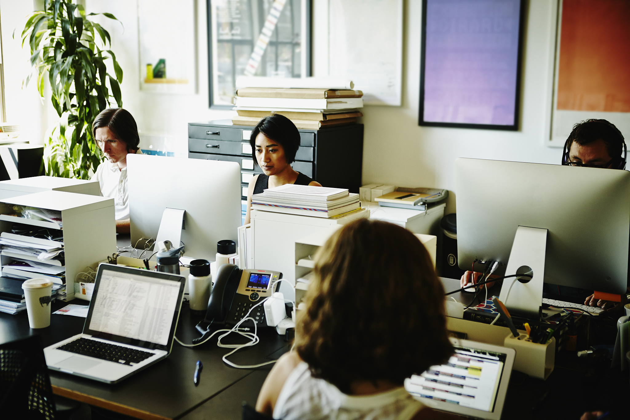 businessmen and businesswomen working in office