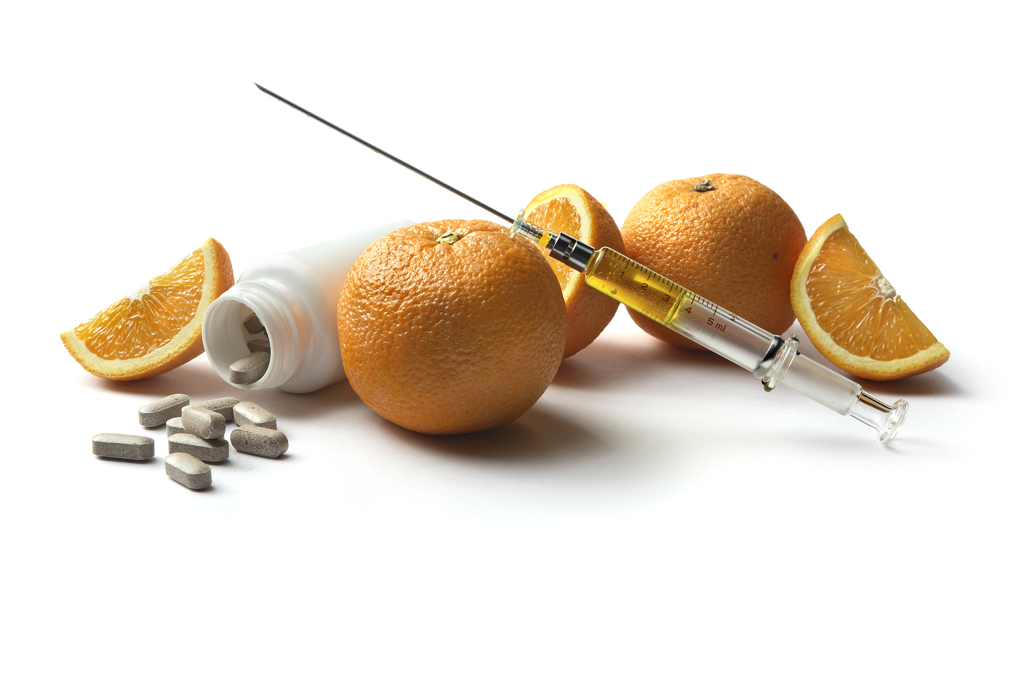 health: oranges, syringe and pills