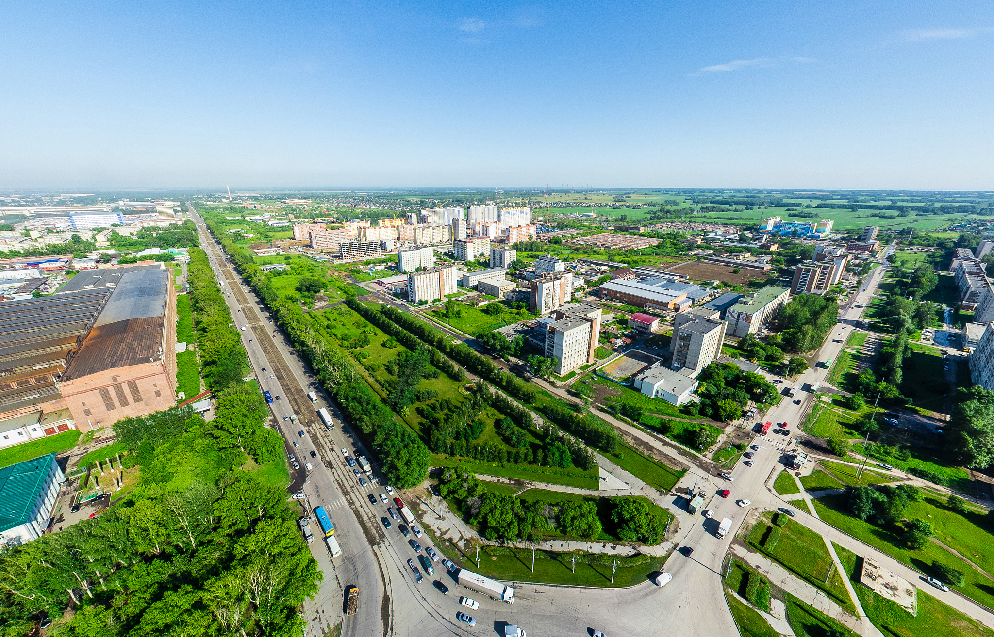 aerial city view with crossroads and roads, houses buildings. co