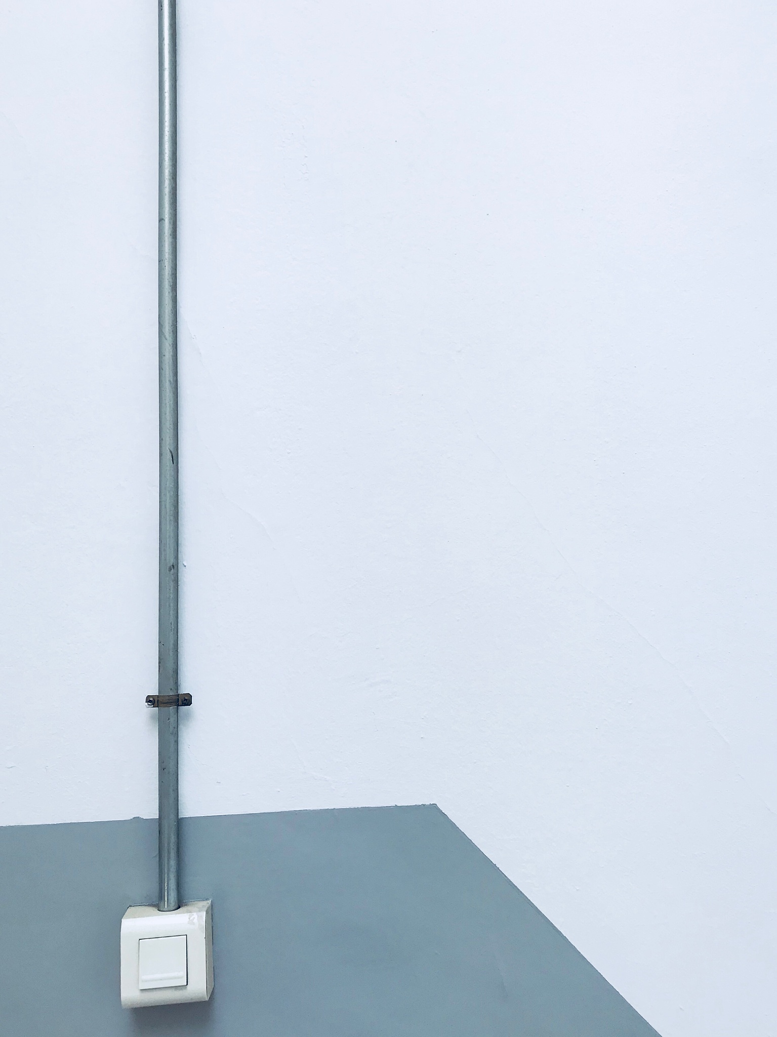 close-up of light switch on white wall