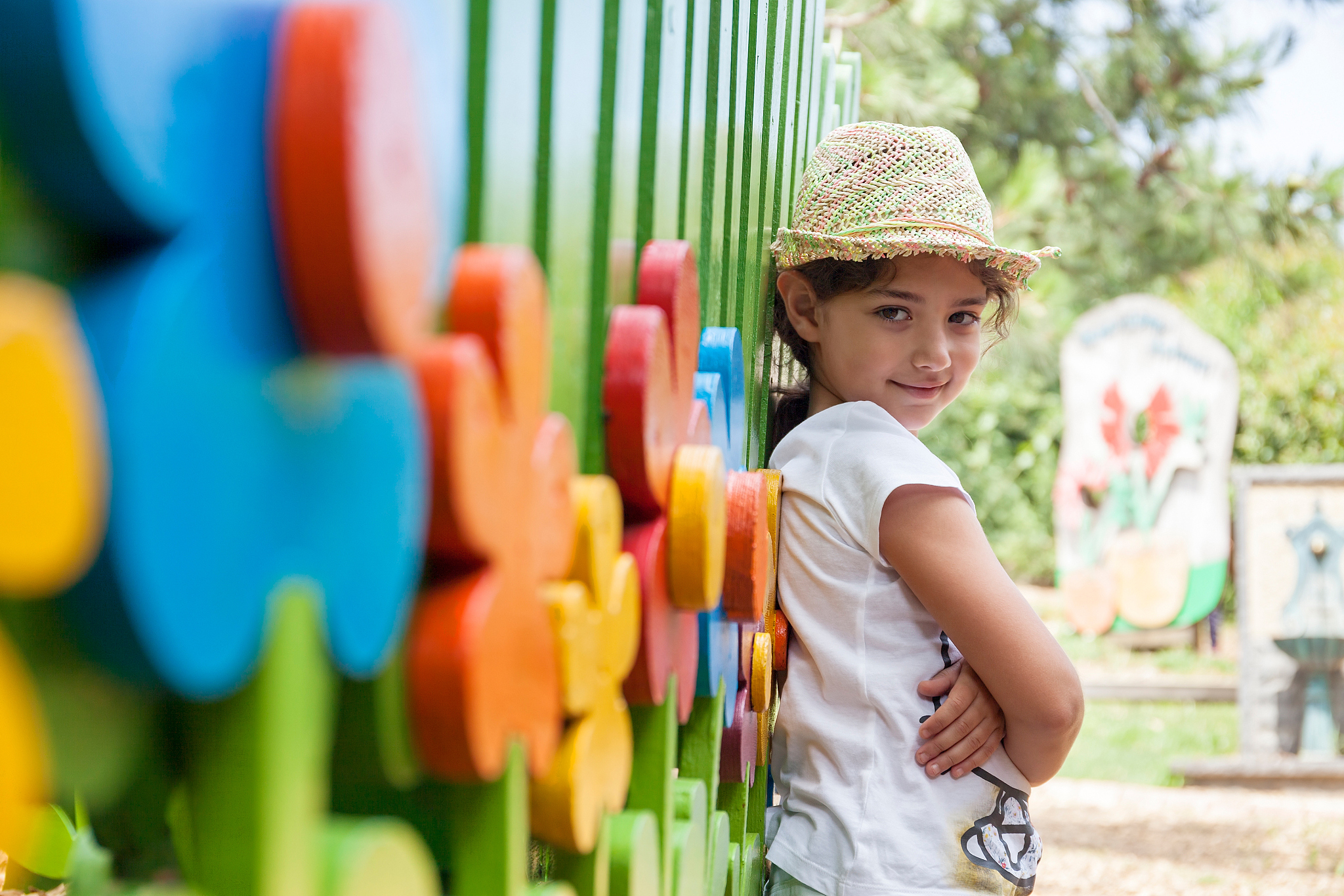 cute beautiful smiling little girl on a playground