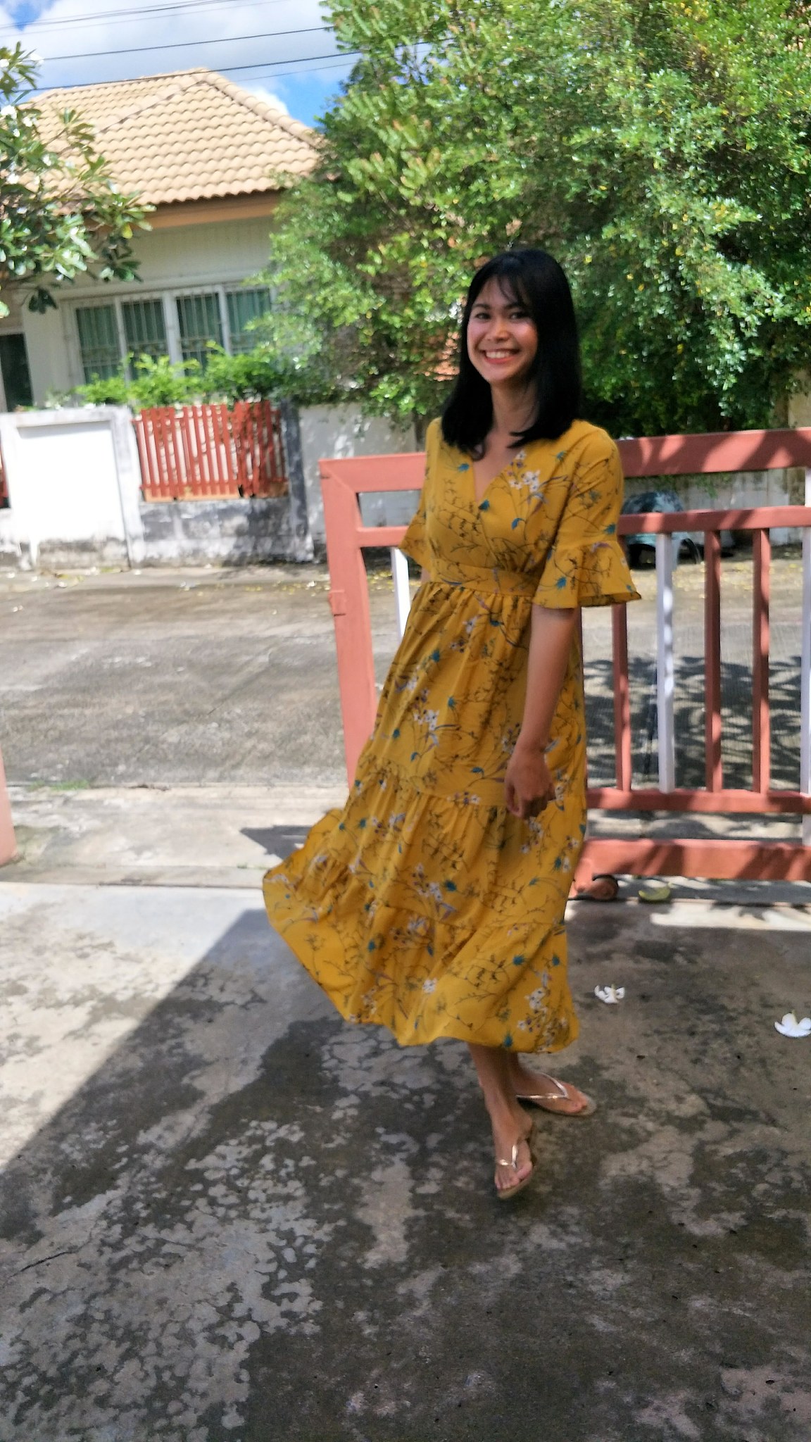 portrait of smiling woman standing outdoors