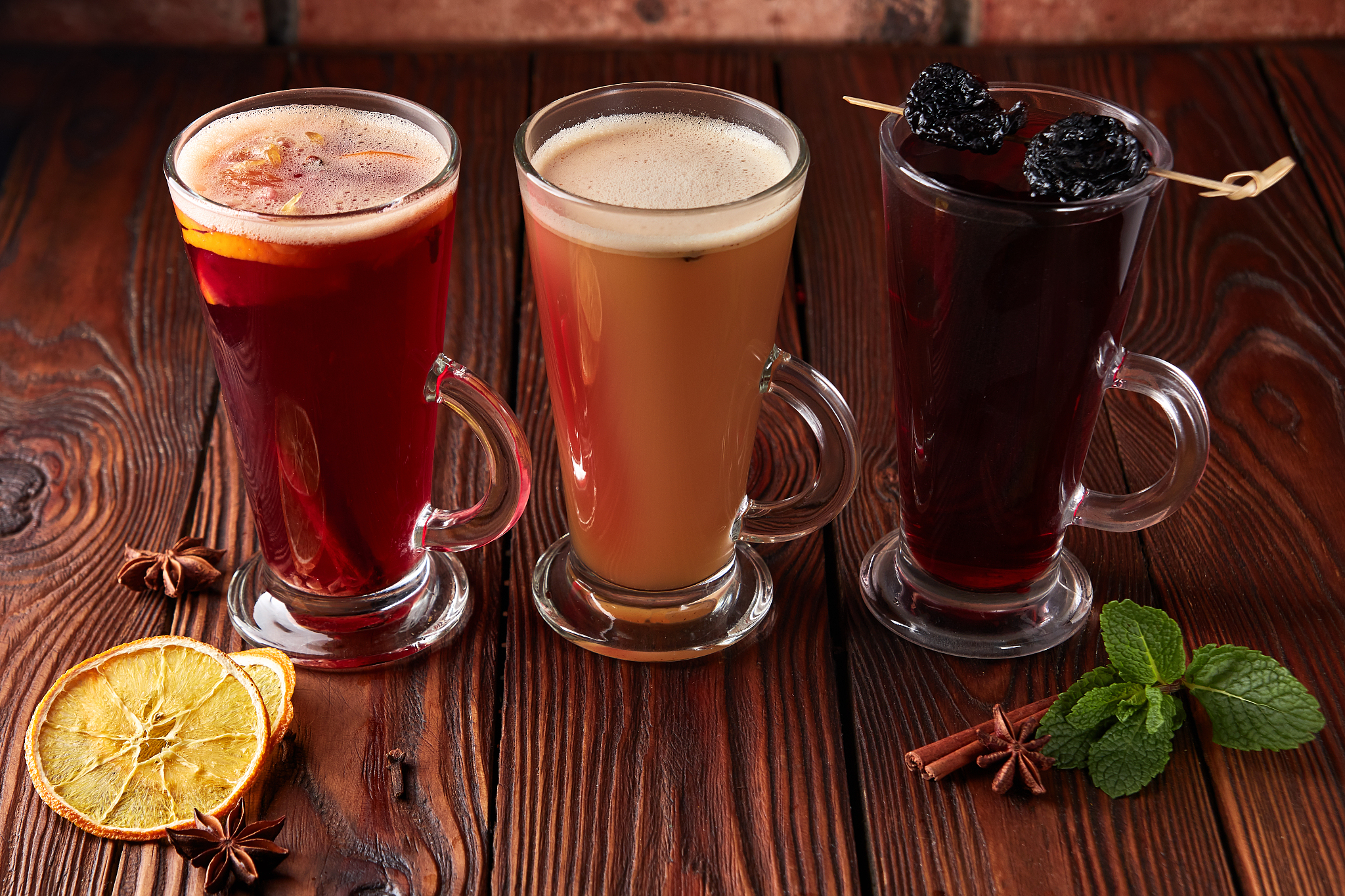 three glasses with hot alcoholic drinks