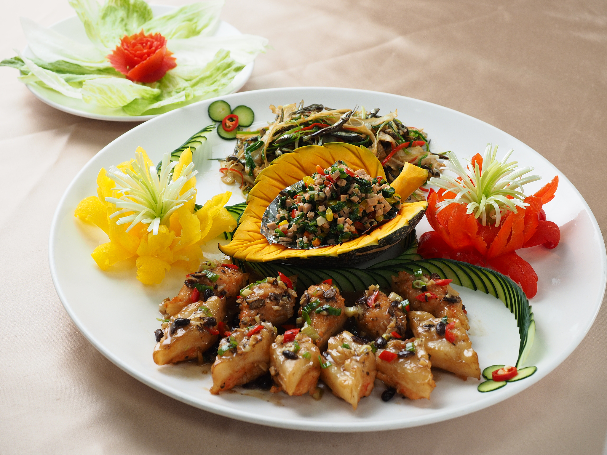 minced fried pork with pumpkin salad on white plate in
