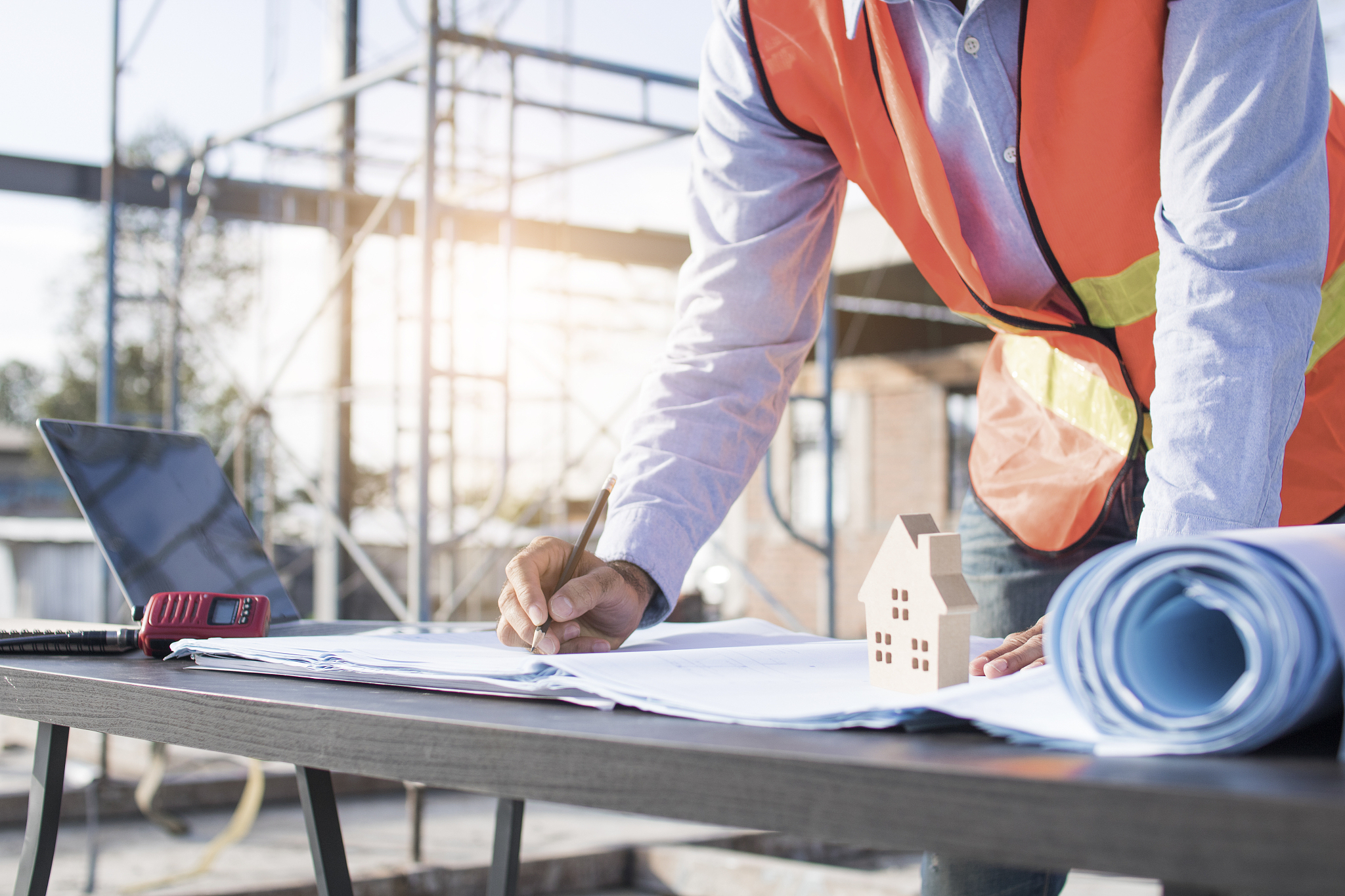 engineer planing and working on table in construction working si
