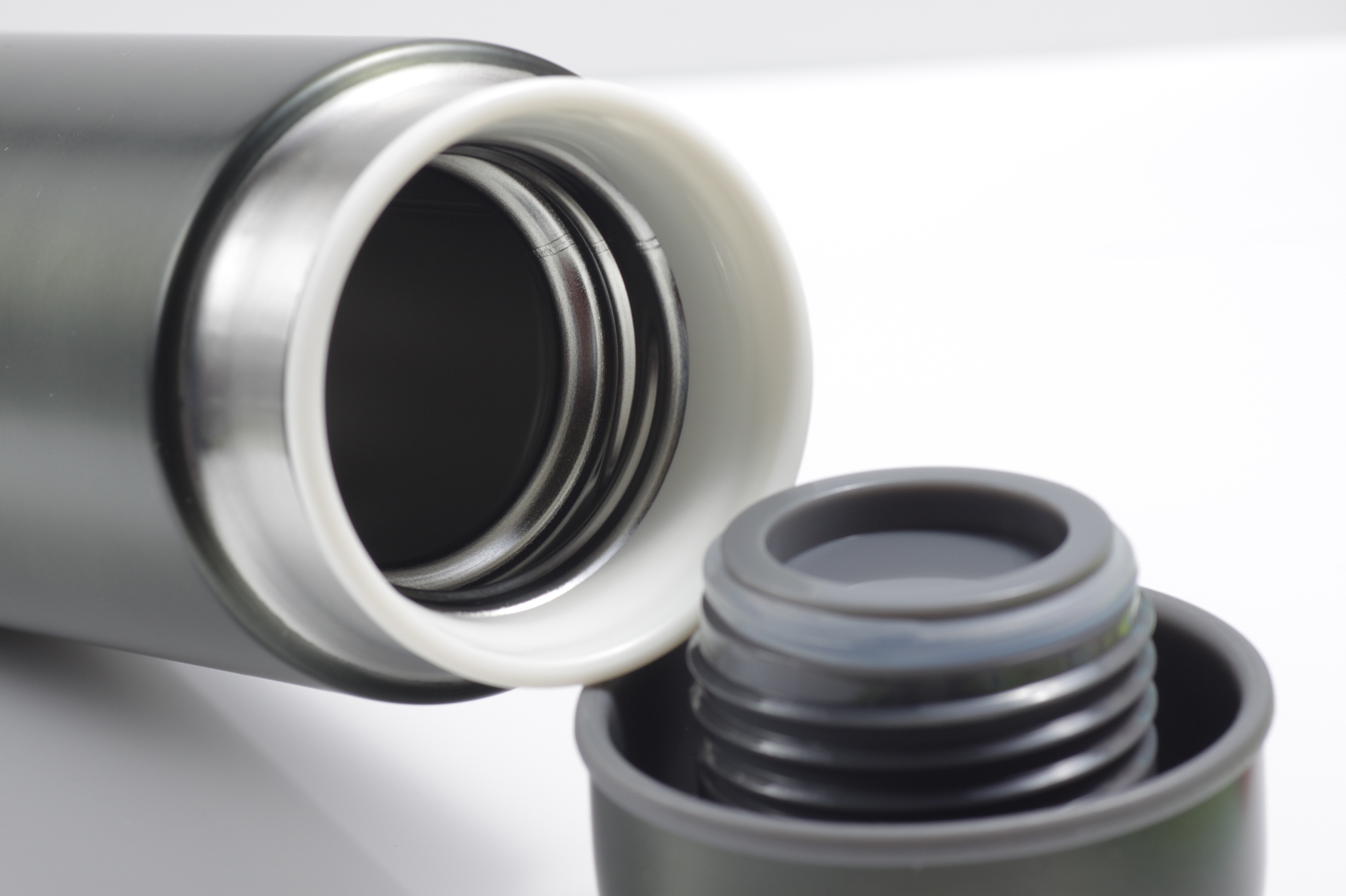 metallic black insulated tumbler on a white isolated background