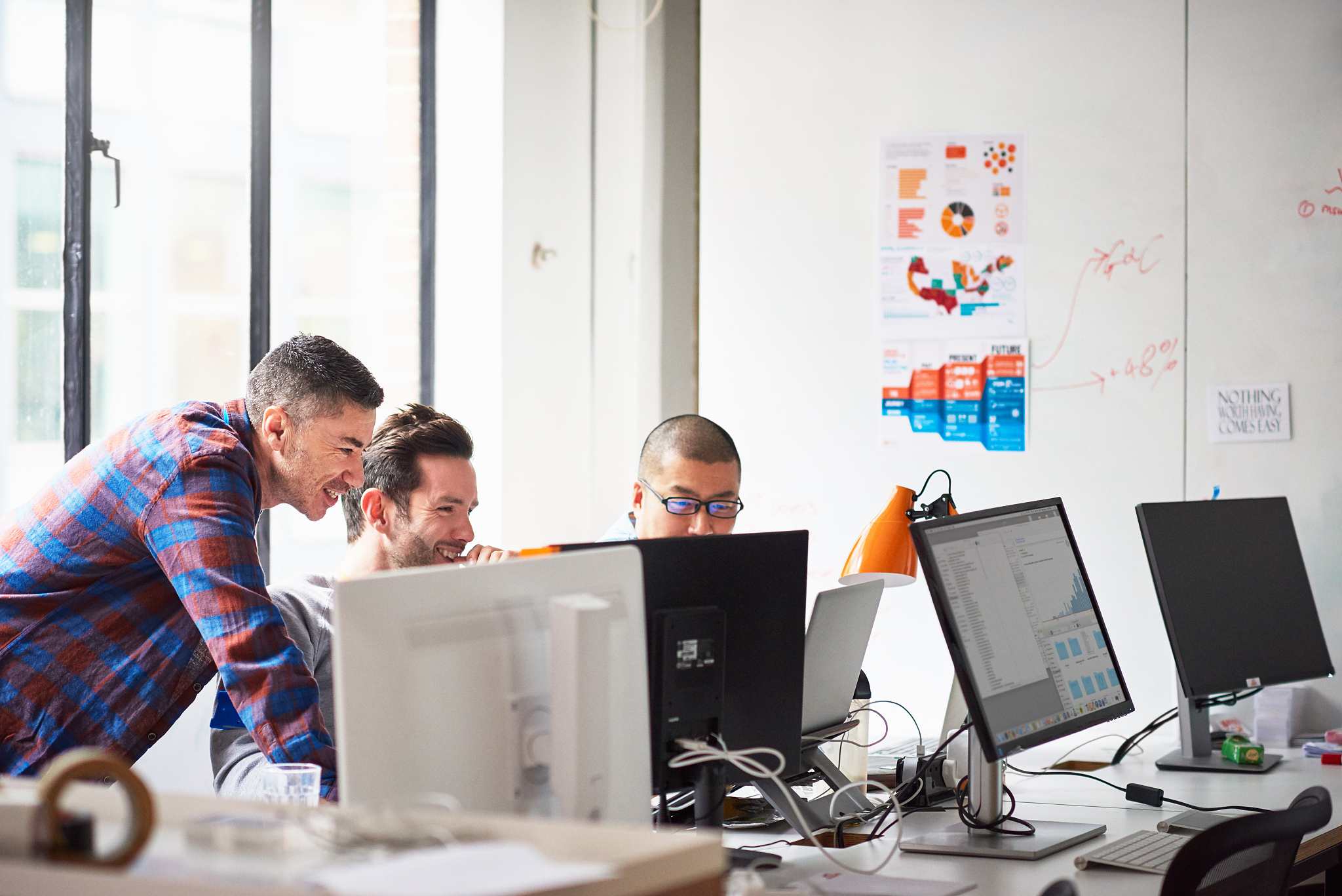 businessmen at computer and tech start-up office