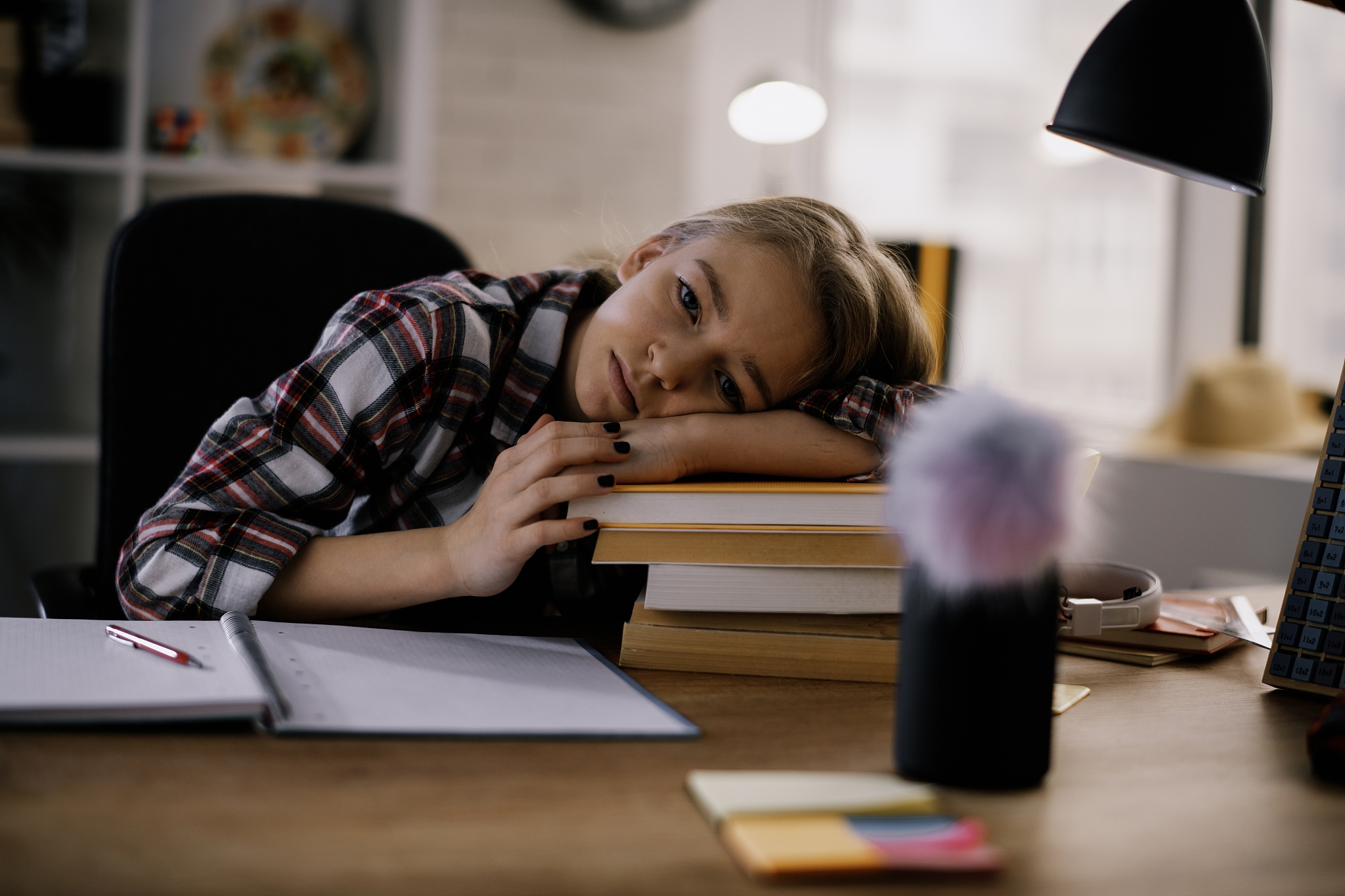 tired beautiful girl learning at her desk.