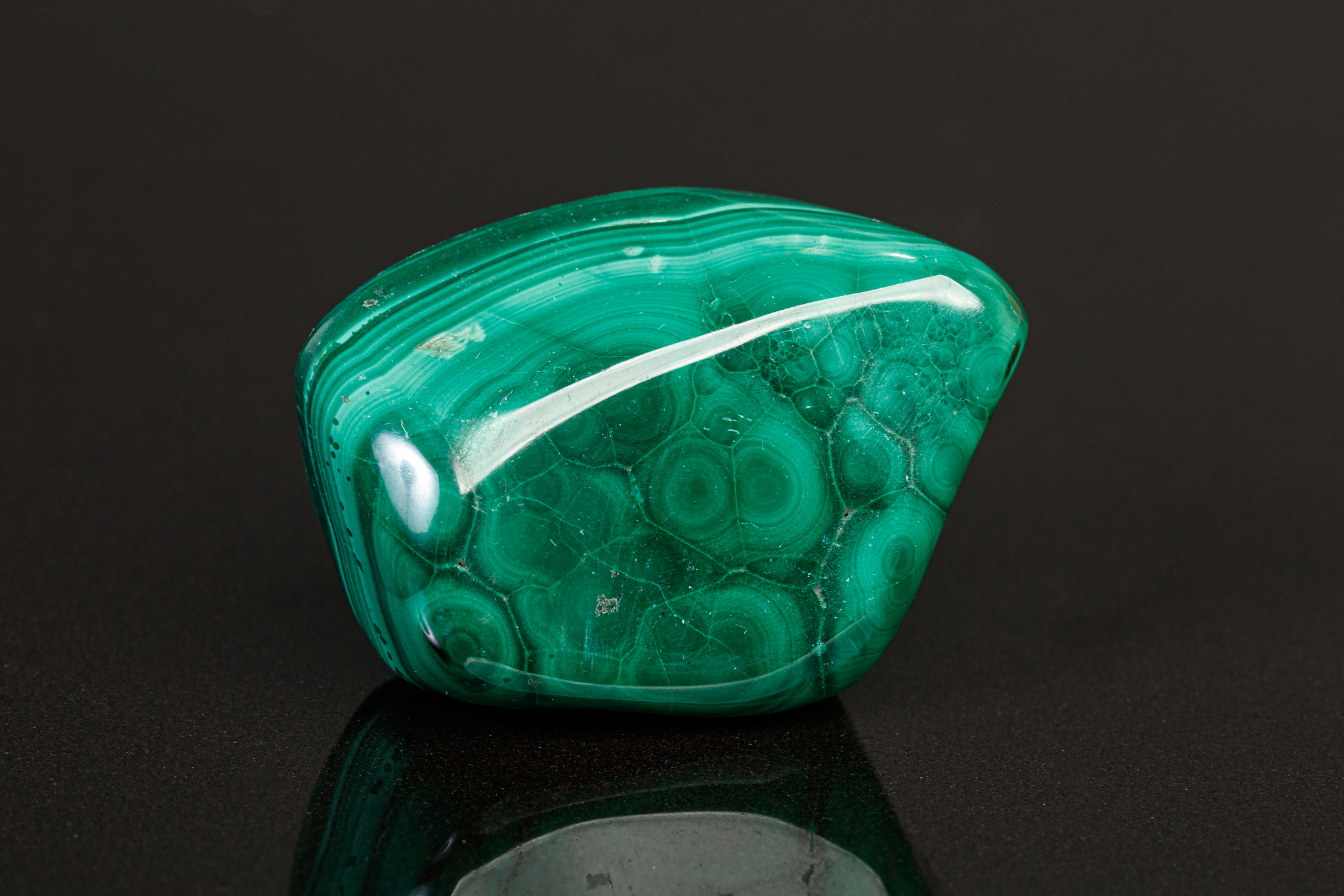 macro mineral stone malachite on a black background