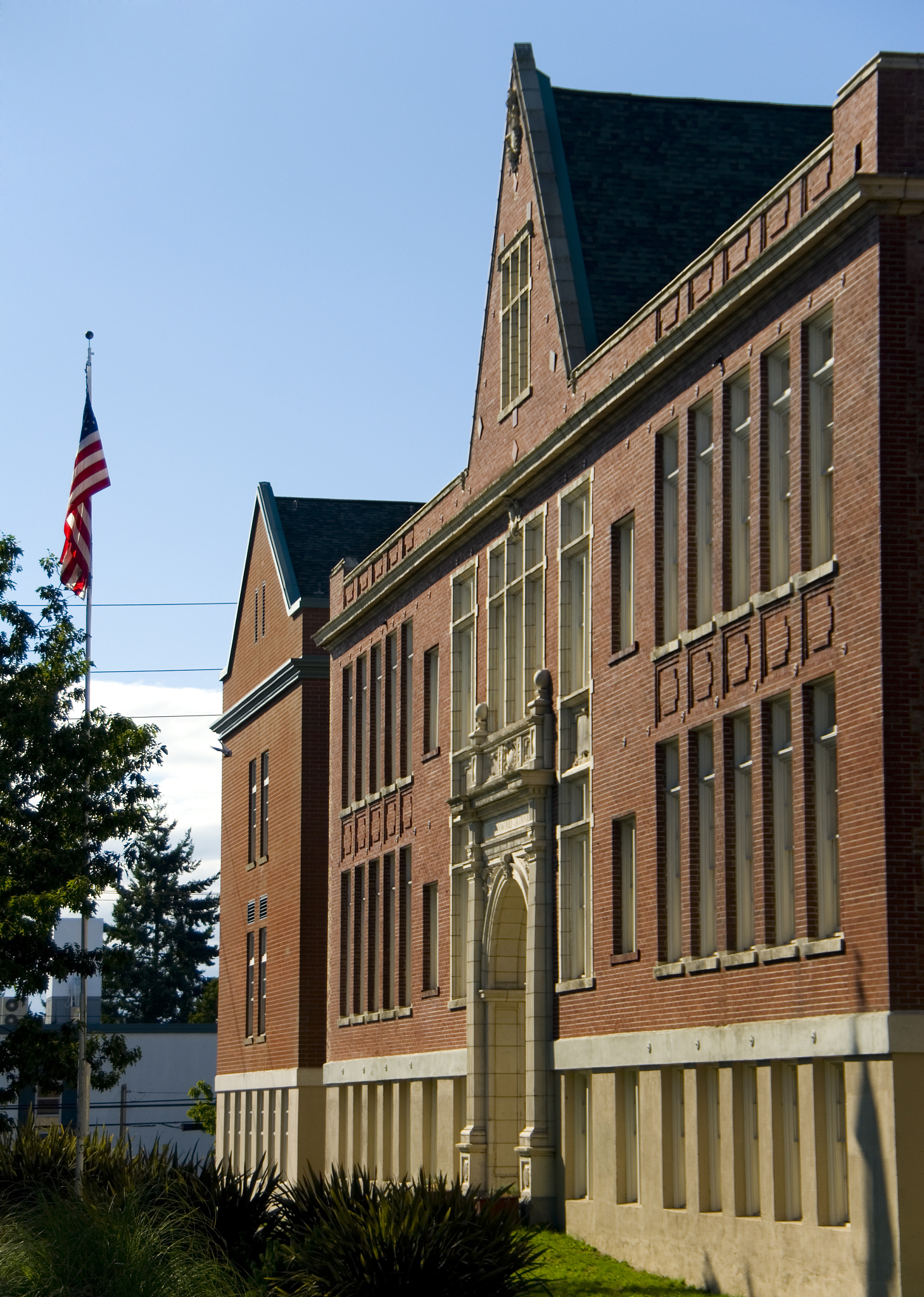 brick school building with flag