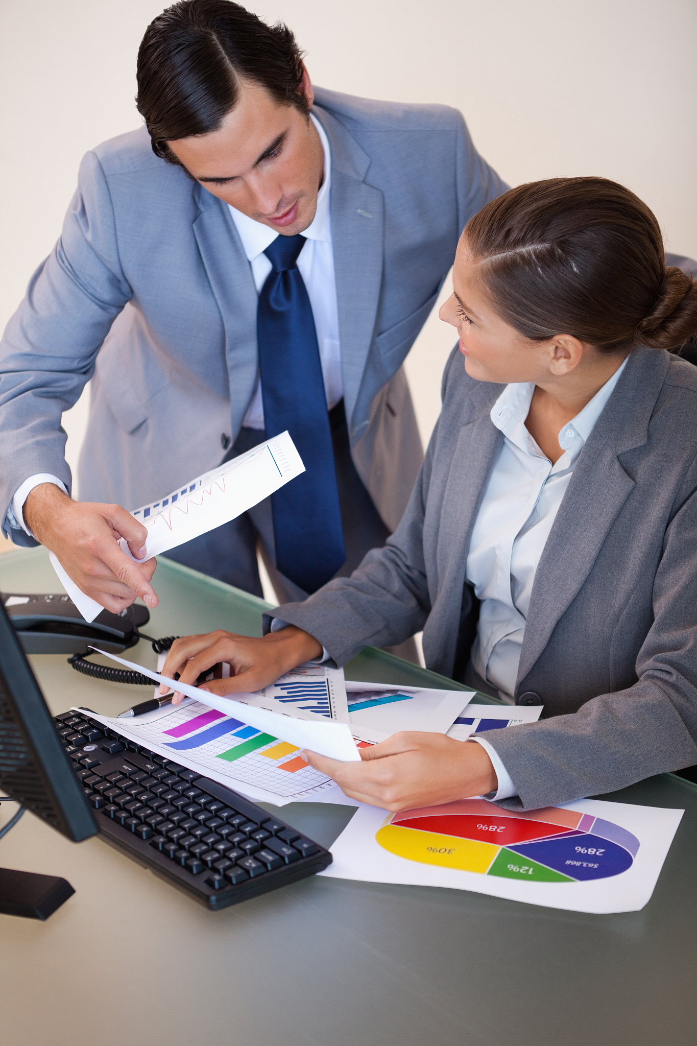 businesswoman talking with her colleague about statistics