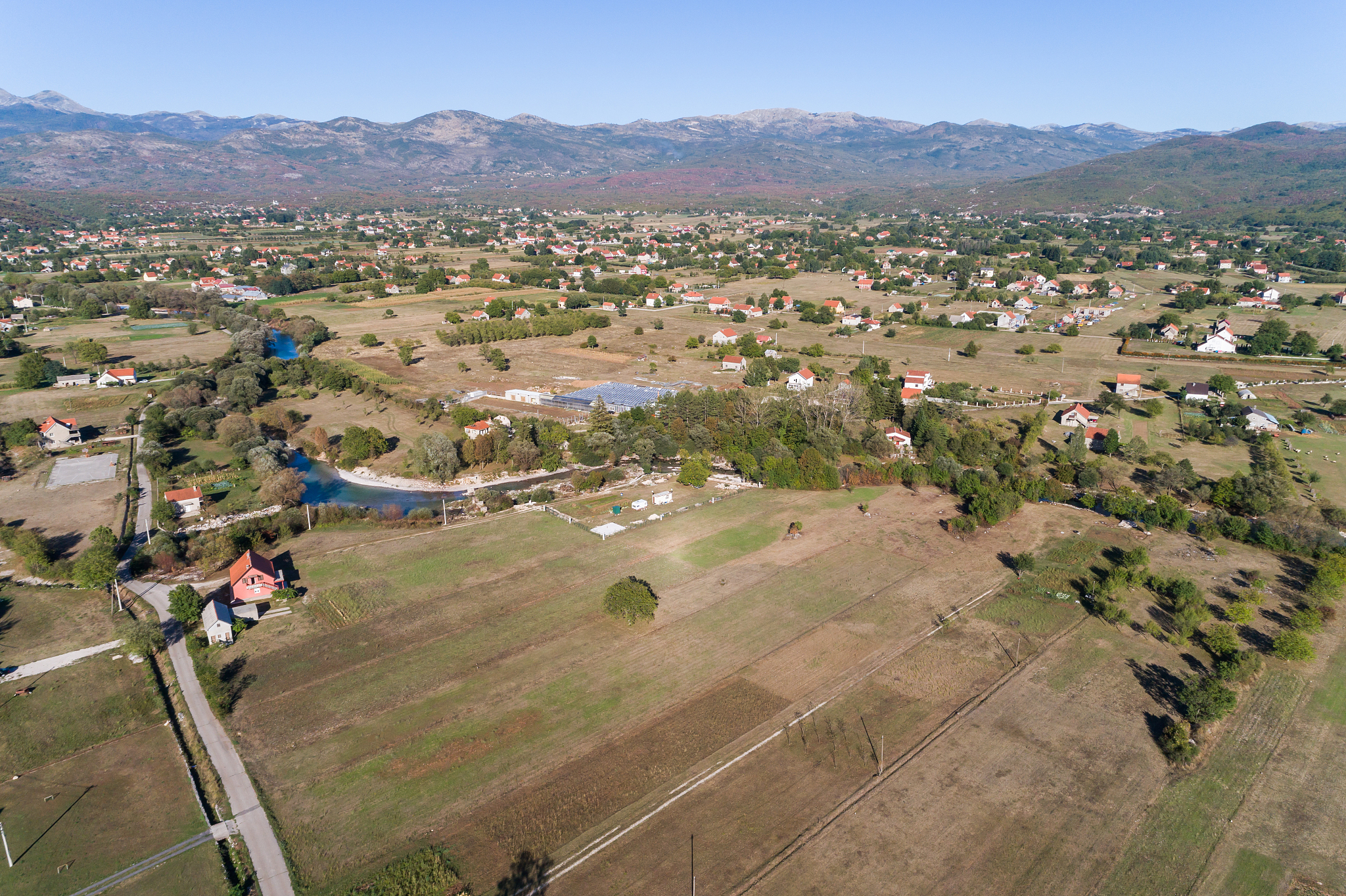 aerial view on autumn fields with village houses. montenegro.