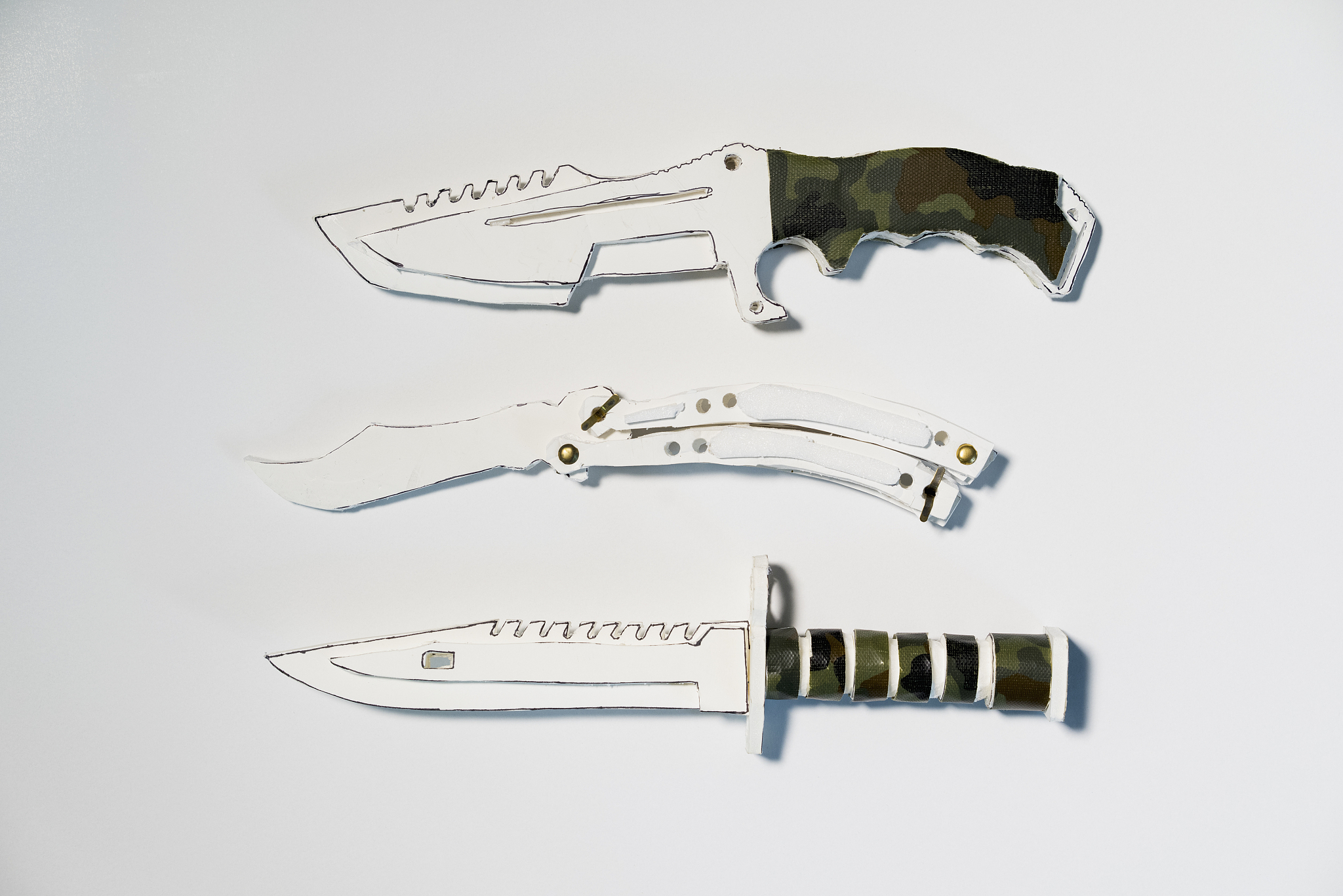 directly above shot of paper knives on white background