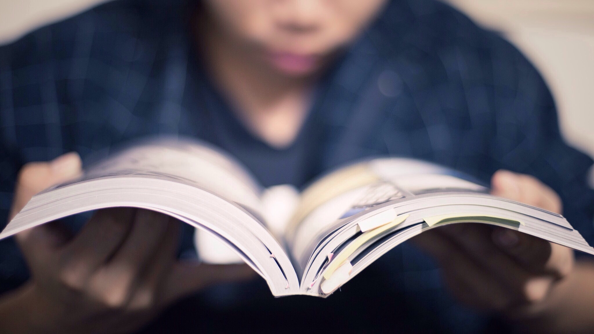 midsection of man reading book