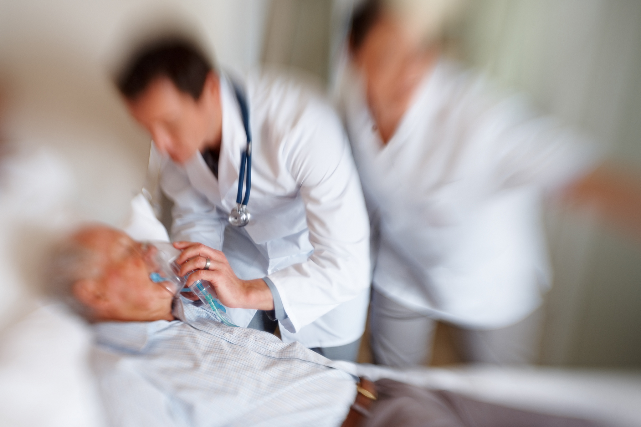 elderly man being treated for a heart attack