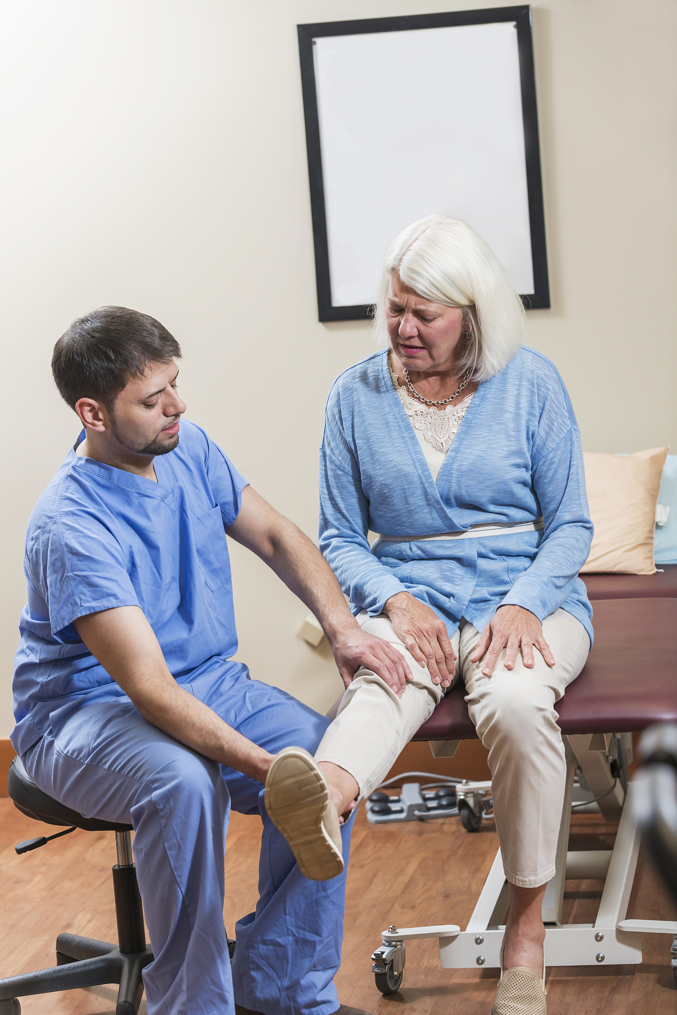mature woman with physical therapist