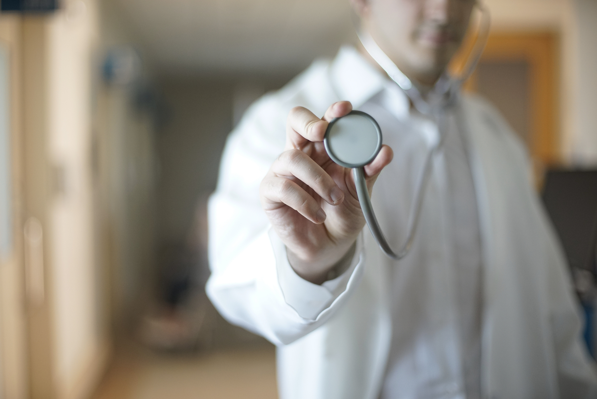 doctor holding stethoscope