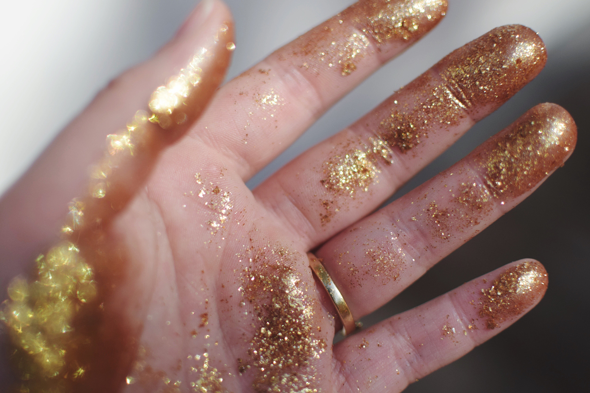 cropped image of hand with glitter