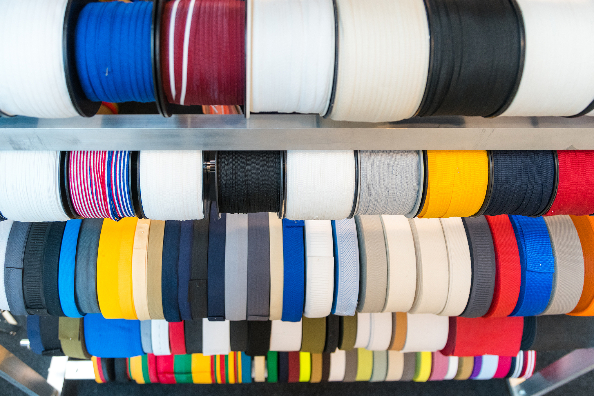 colourful embroidery thread spool using in garment industry, row