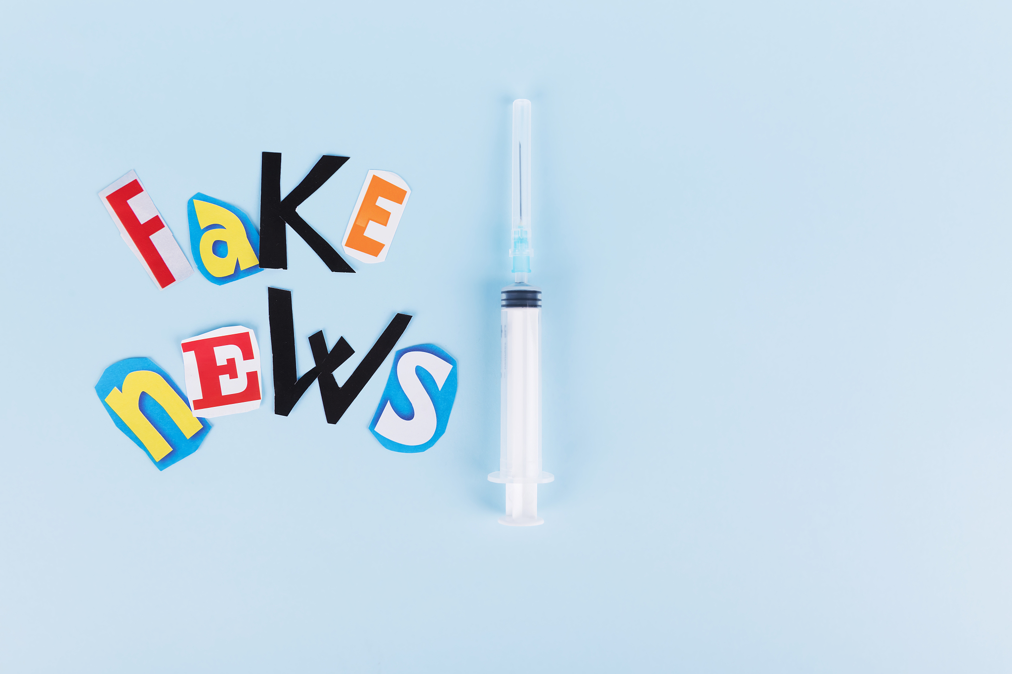 l'insciption fake news, collage of colored paper's letters, and 