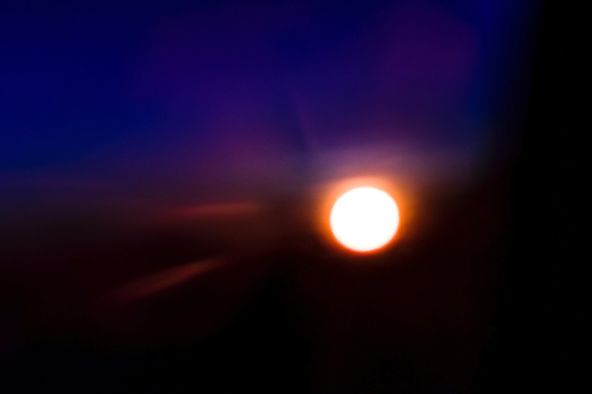 sunset taken from inside the plane.
