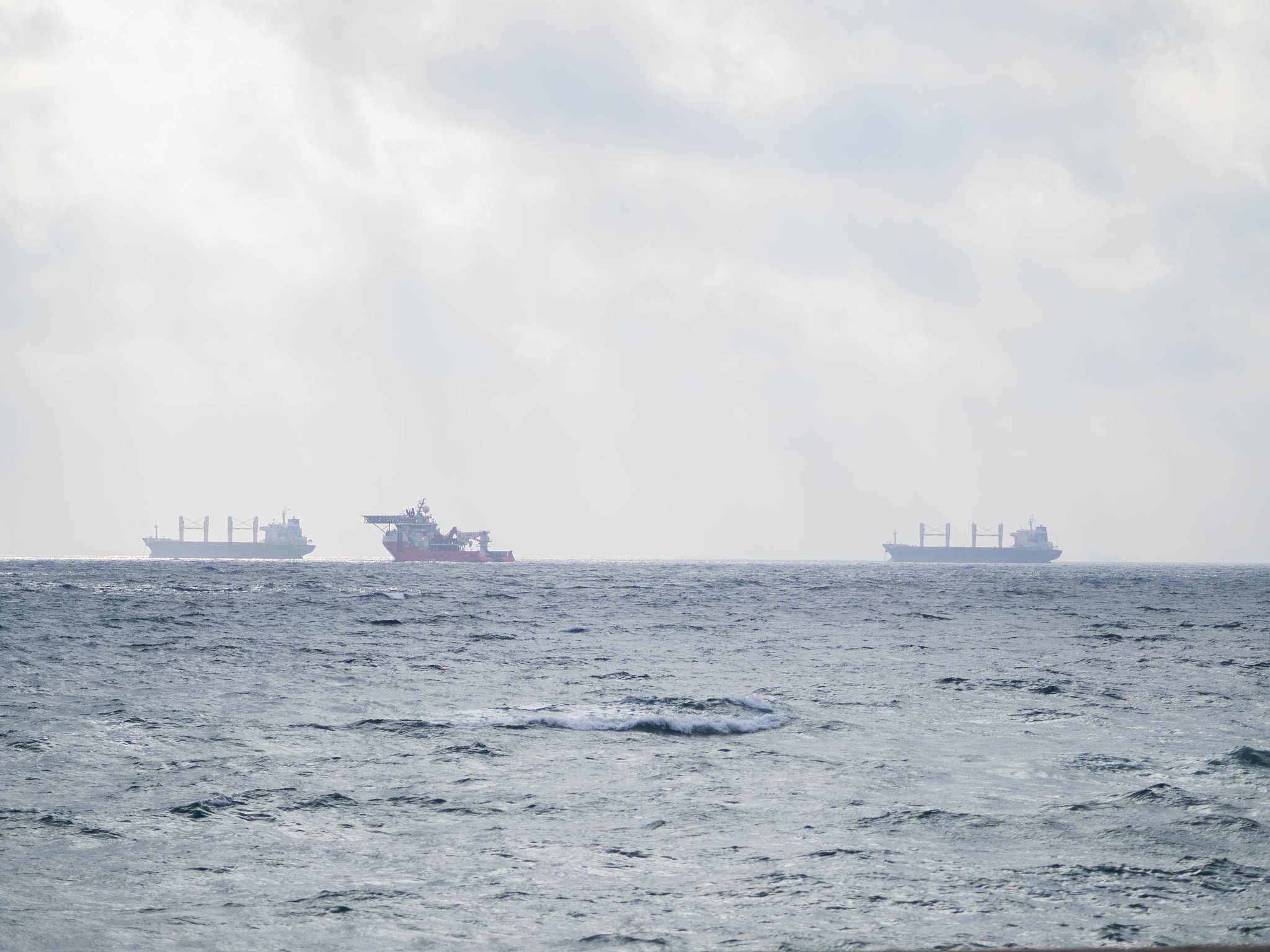 ship sailing on sea against sky