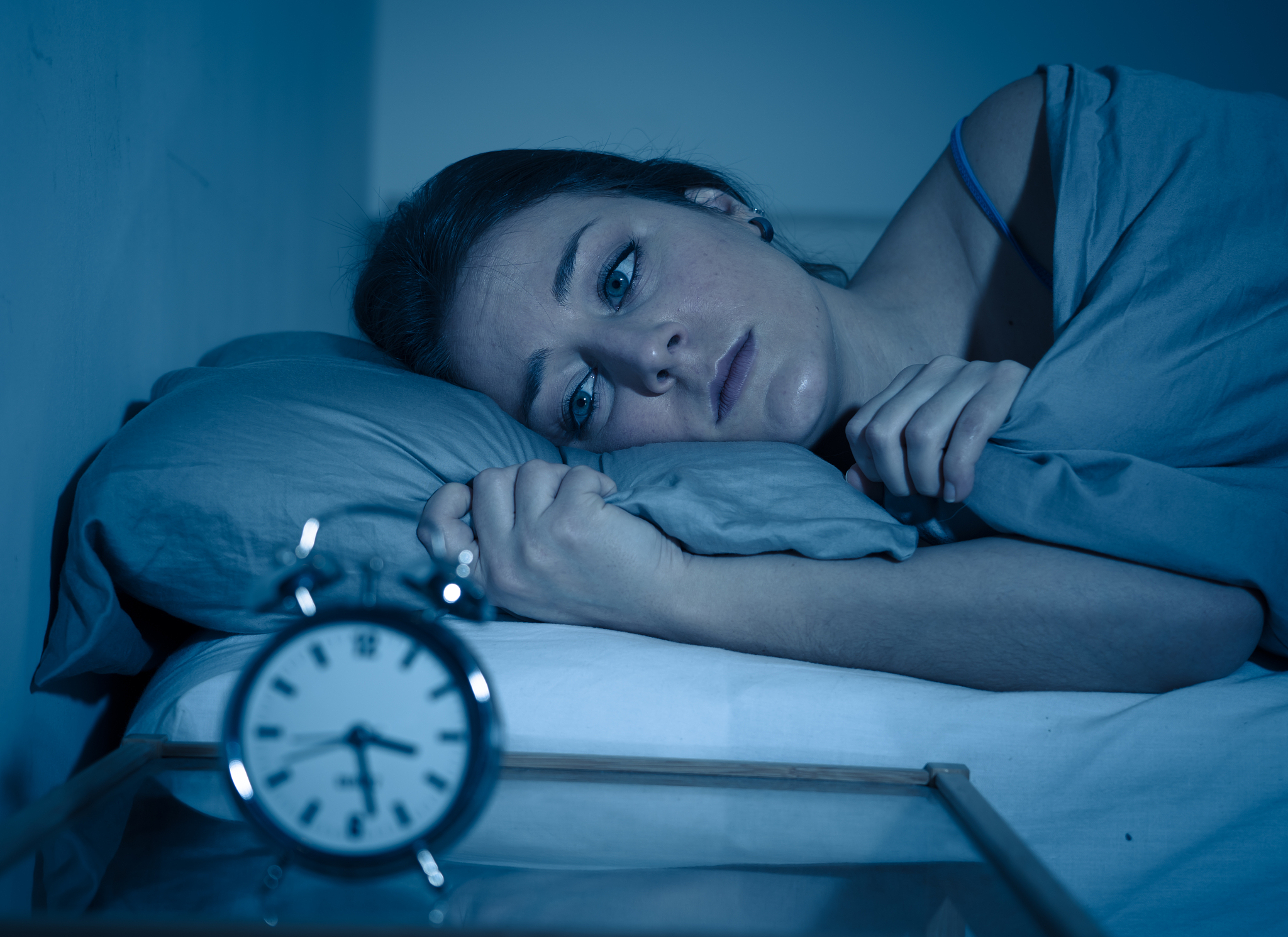 sleepless and desperate beautiful caucasian woman awake at night