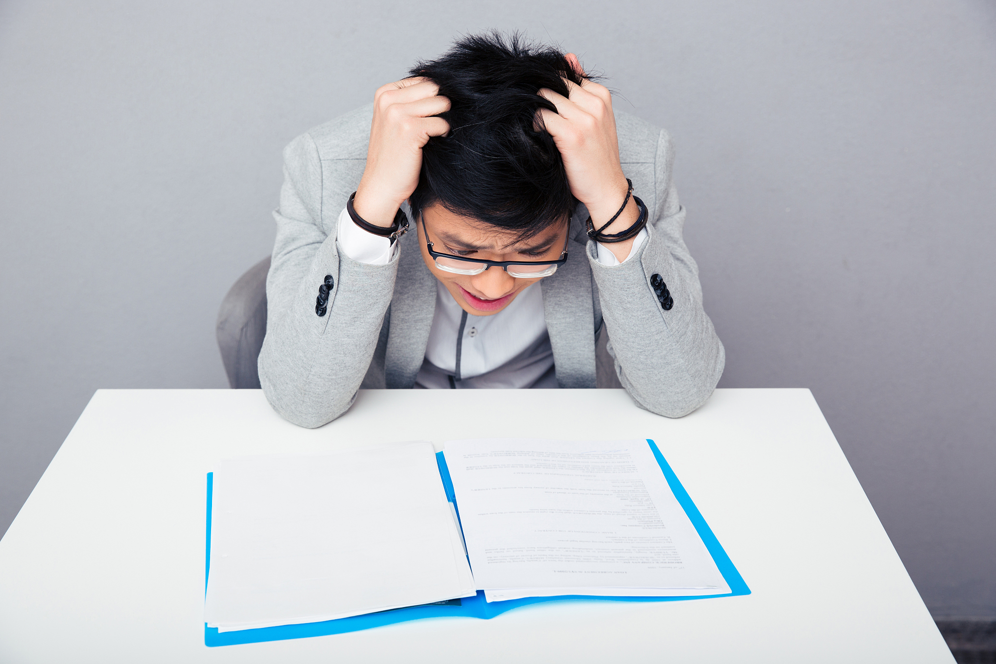 worried businessman reading papers
