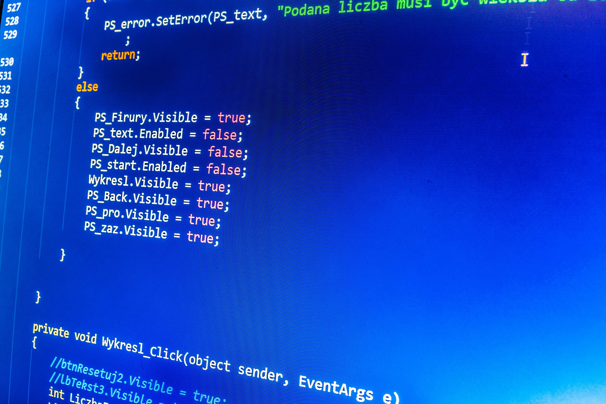 software developer programming code on computer