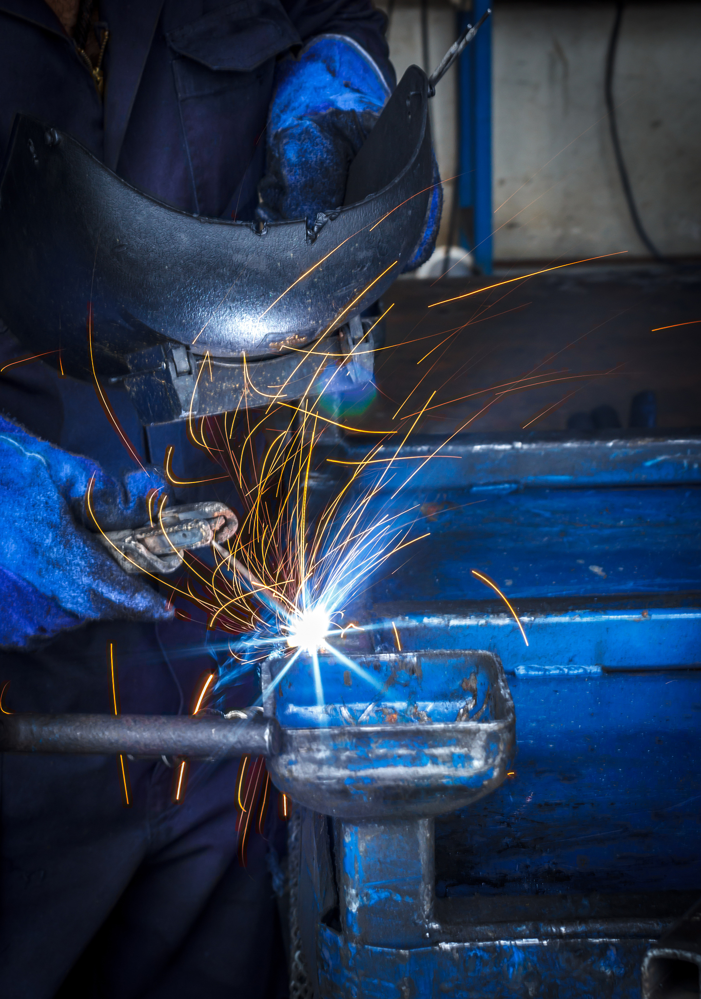 welder, iron in a factory