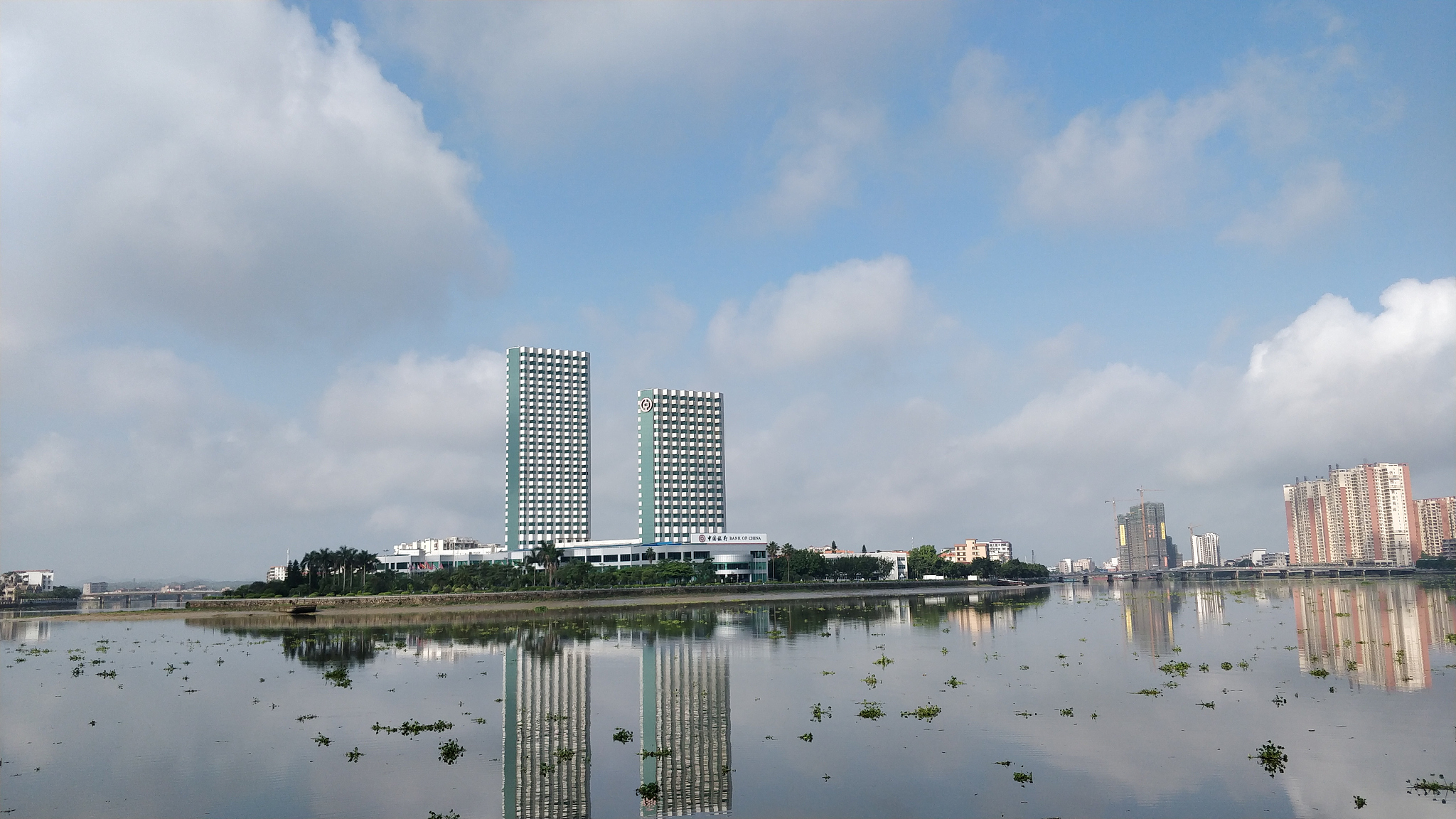 panoramic view of city buildings against sky