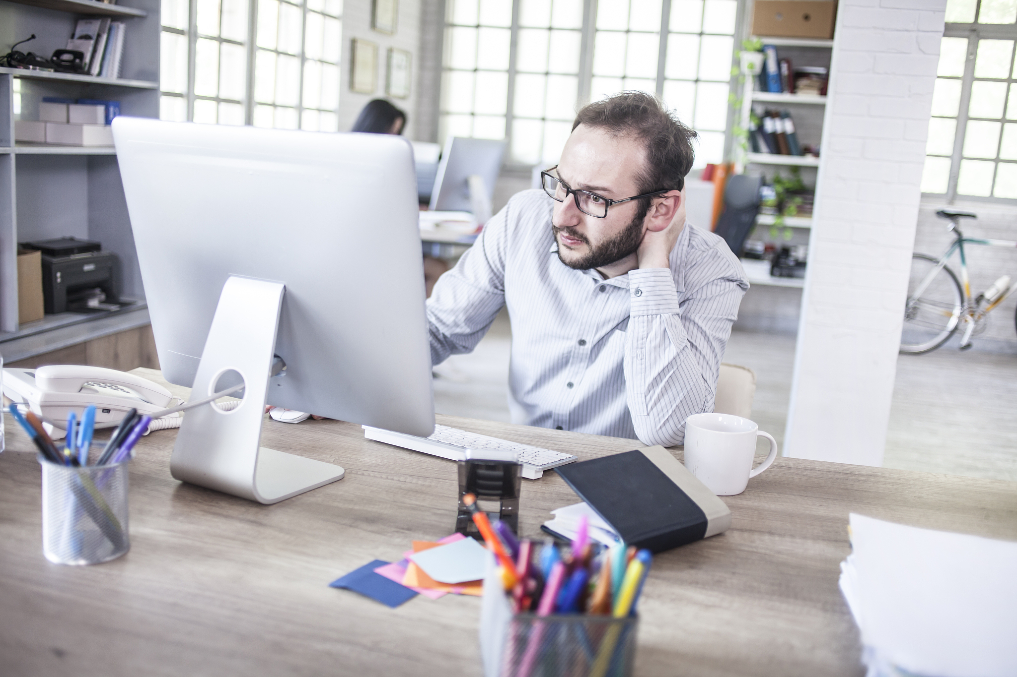 young businessman having problems at the office