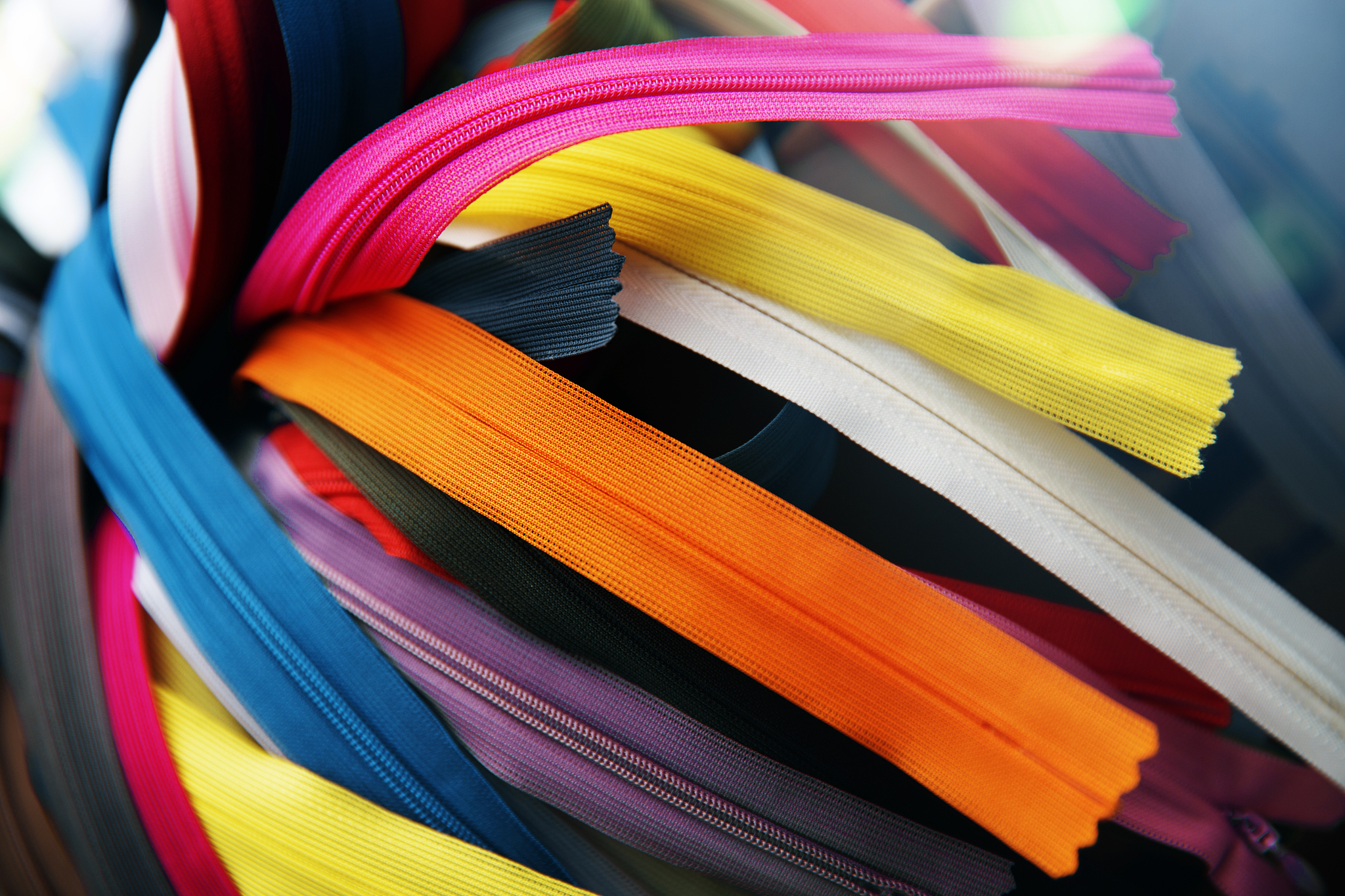 bunch of multicolored zippers