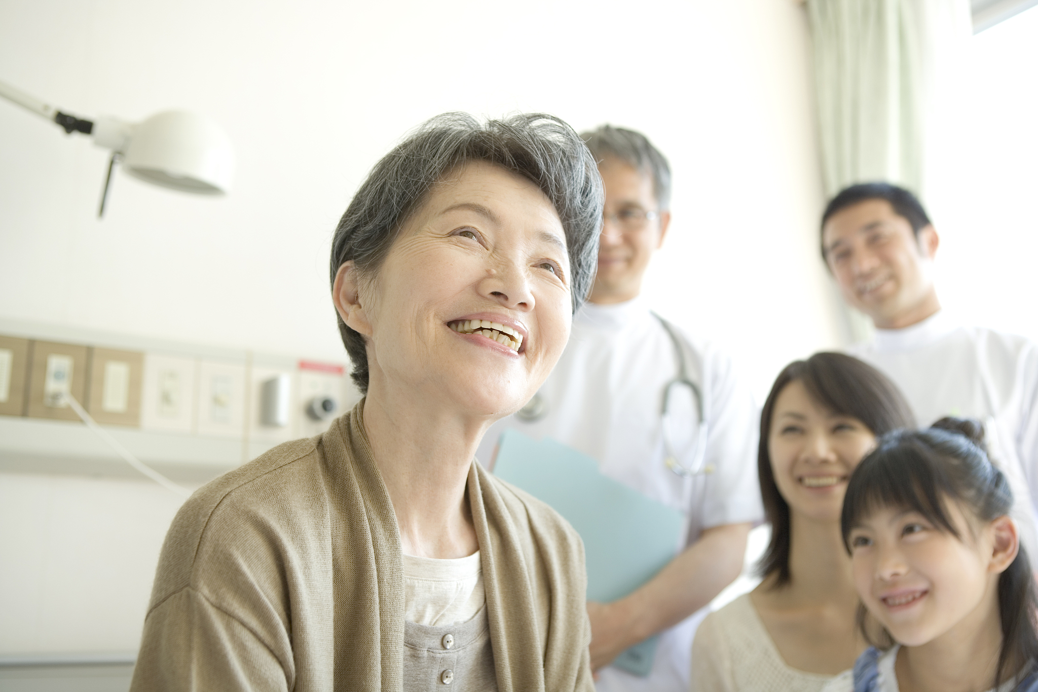 senior woman smiling on bed
