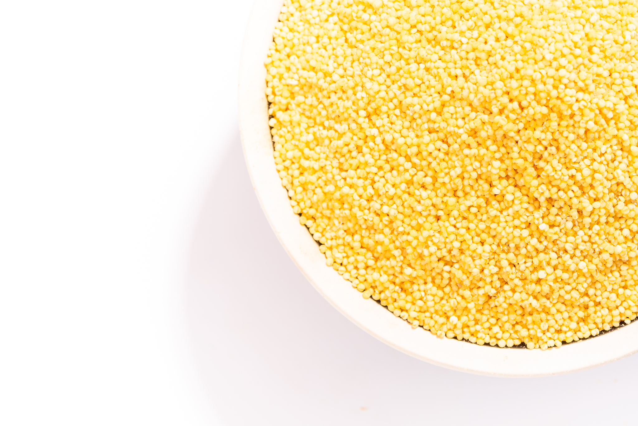 yellow millet in bowl