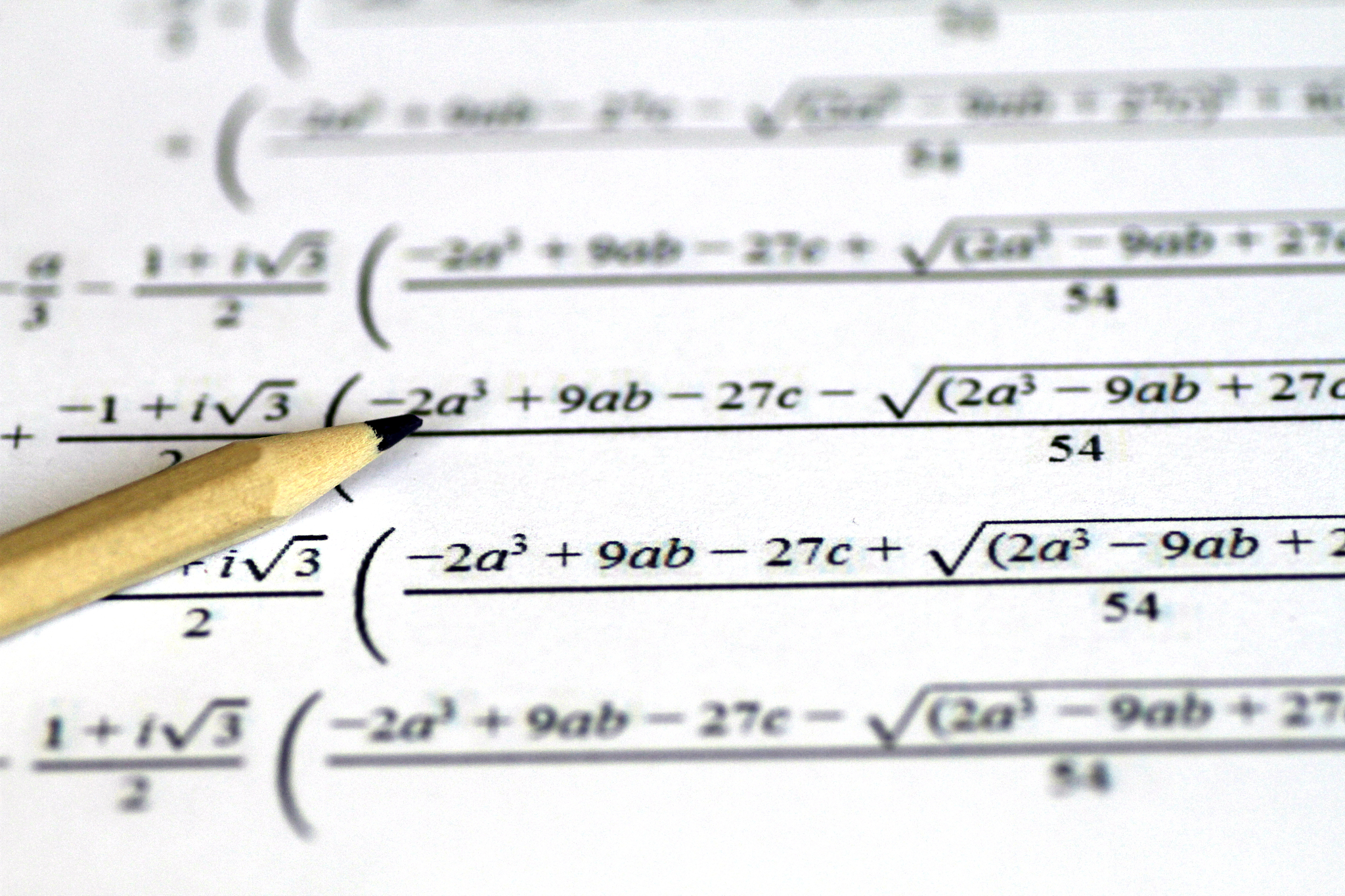 math equations on paper with pencil