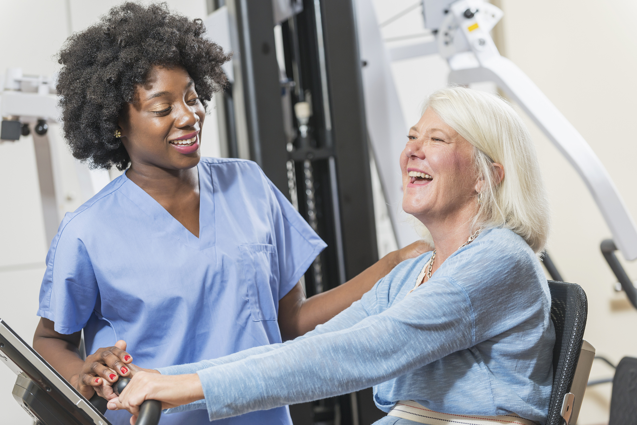 african american physical therapist working with patient
