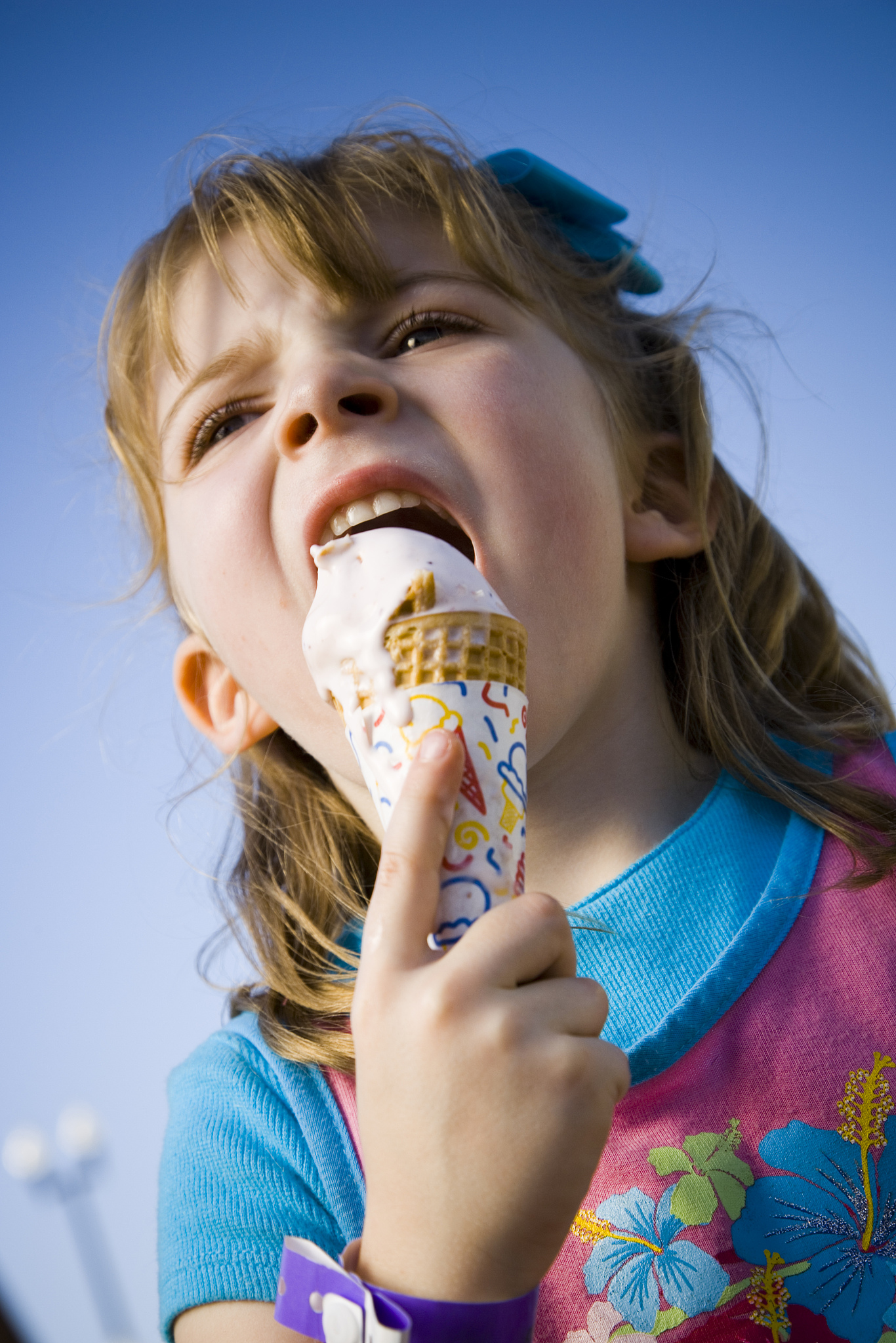 young girl eating ice cream cone