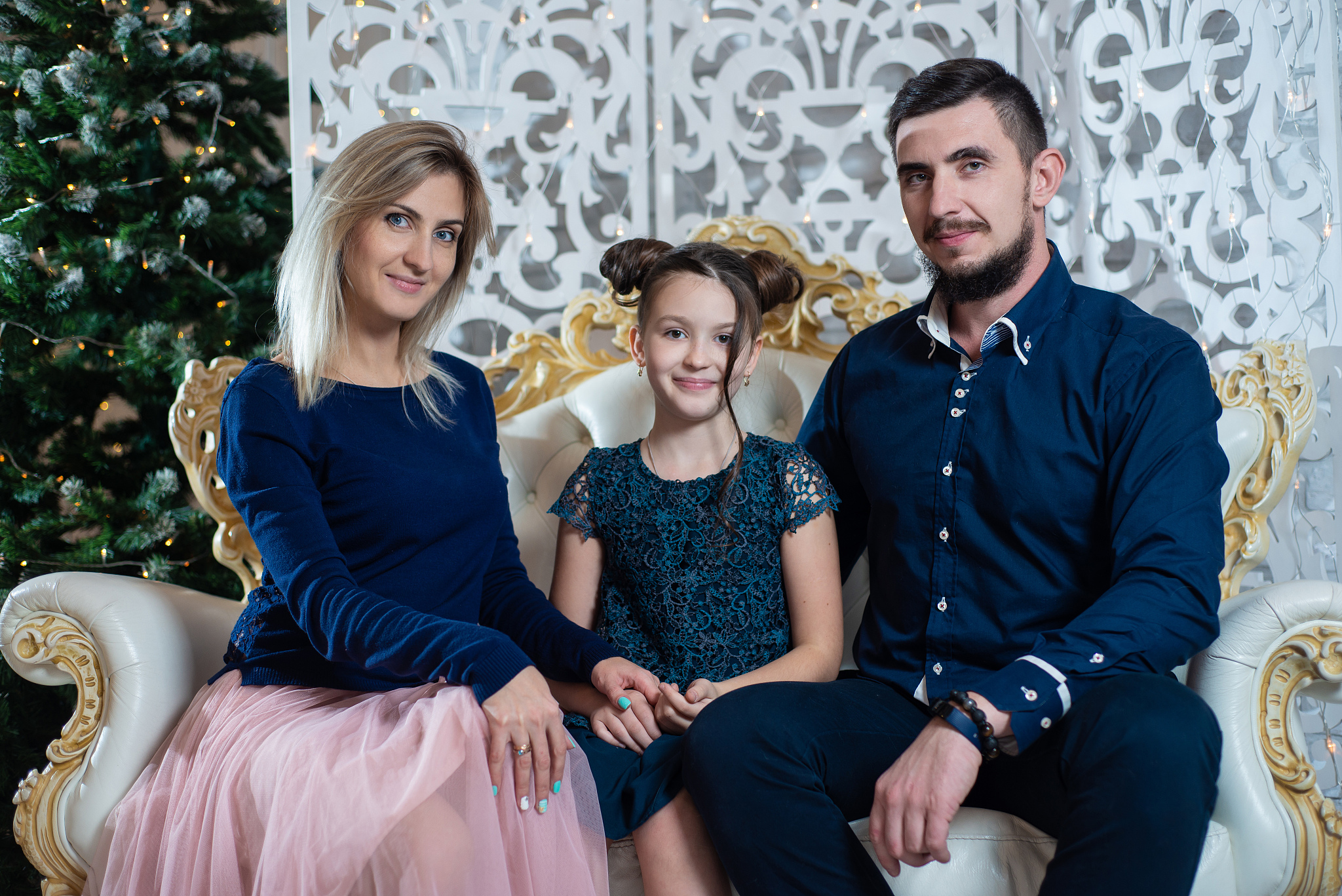 christmas photo of happy family on background of decorated chris