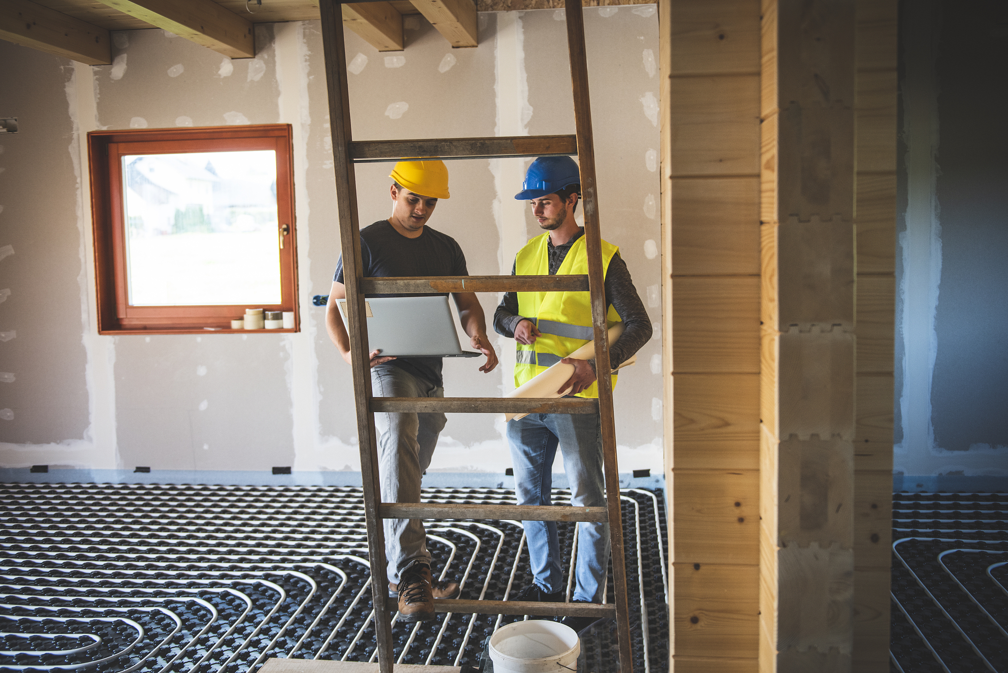 professional male engineer using laptop on construction site