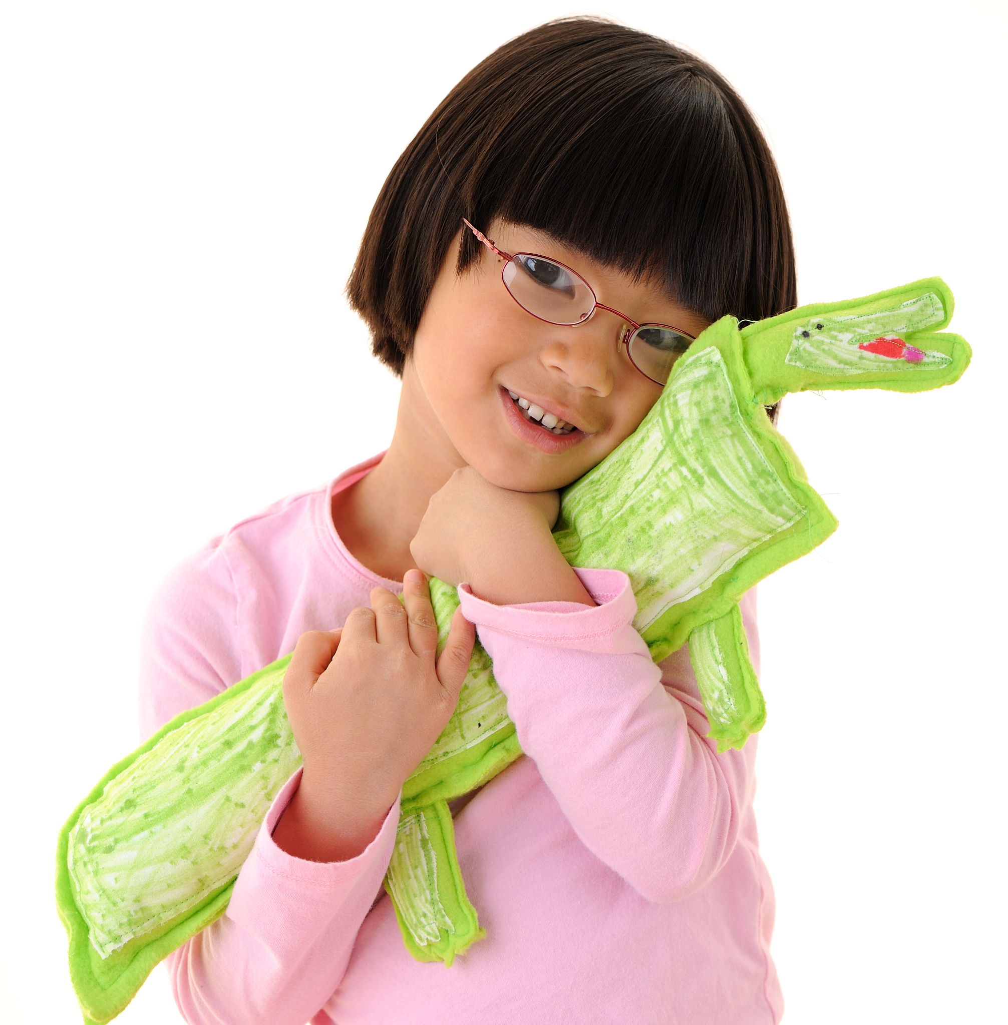 creative child: girl holding homemade stuffed alligator