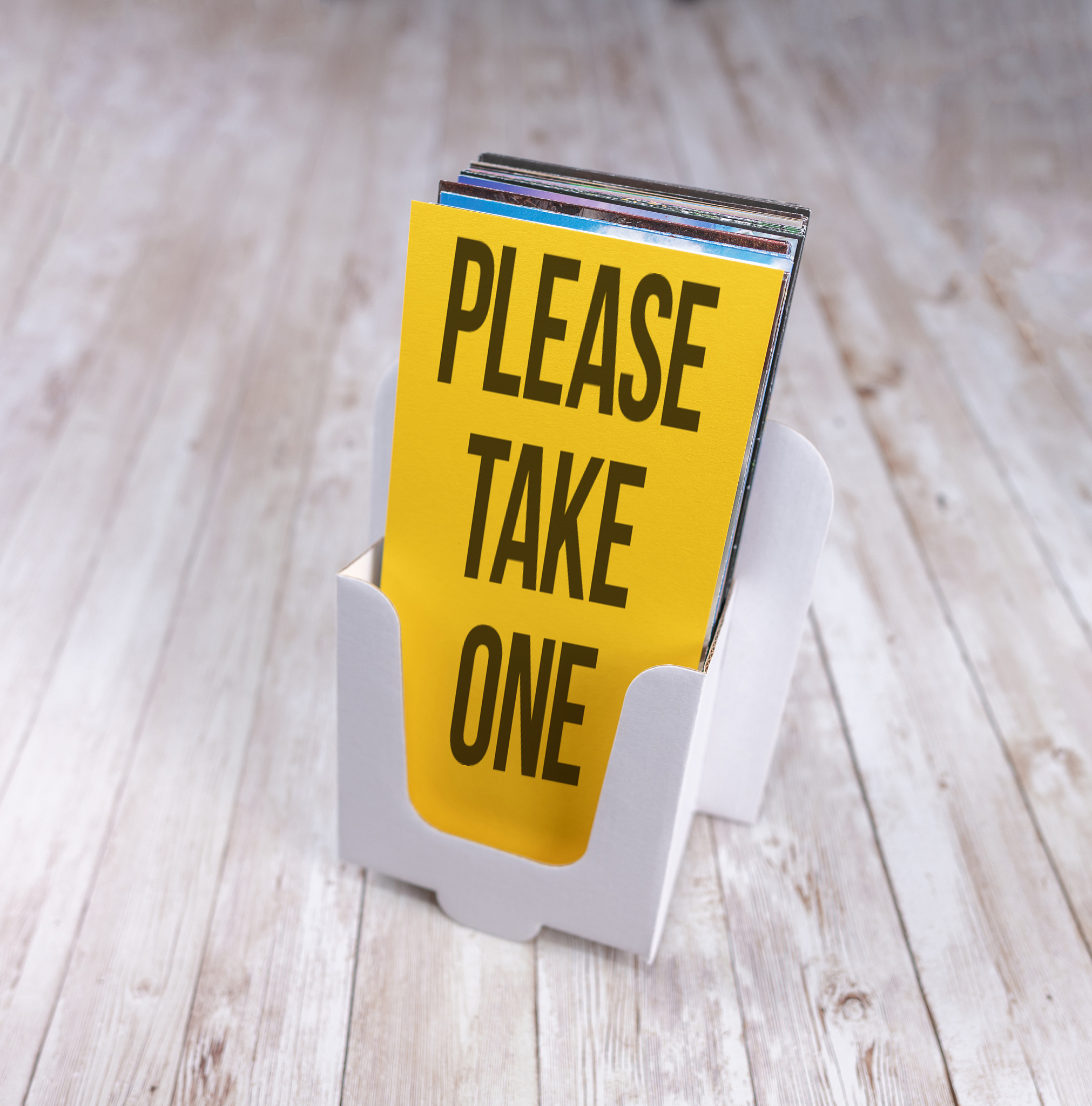 leaflet holder saying "please take one"