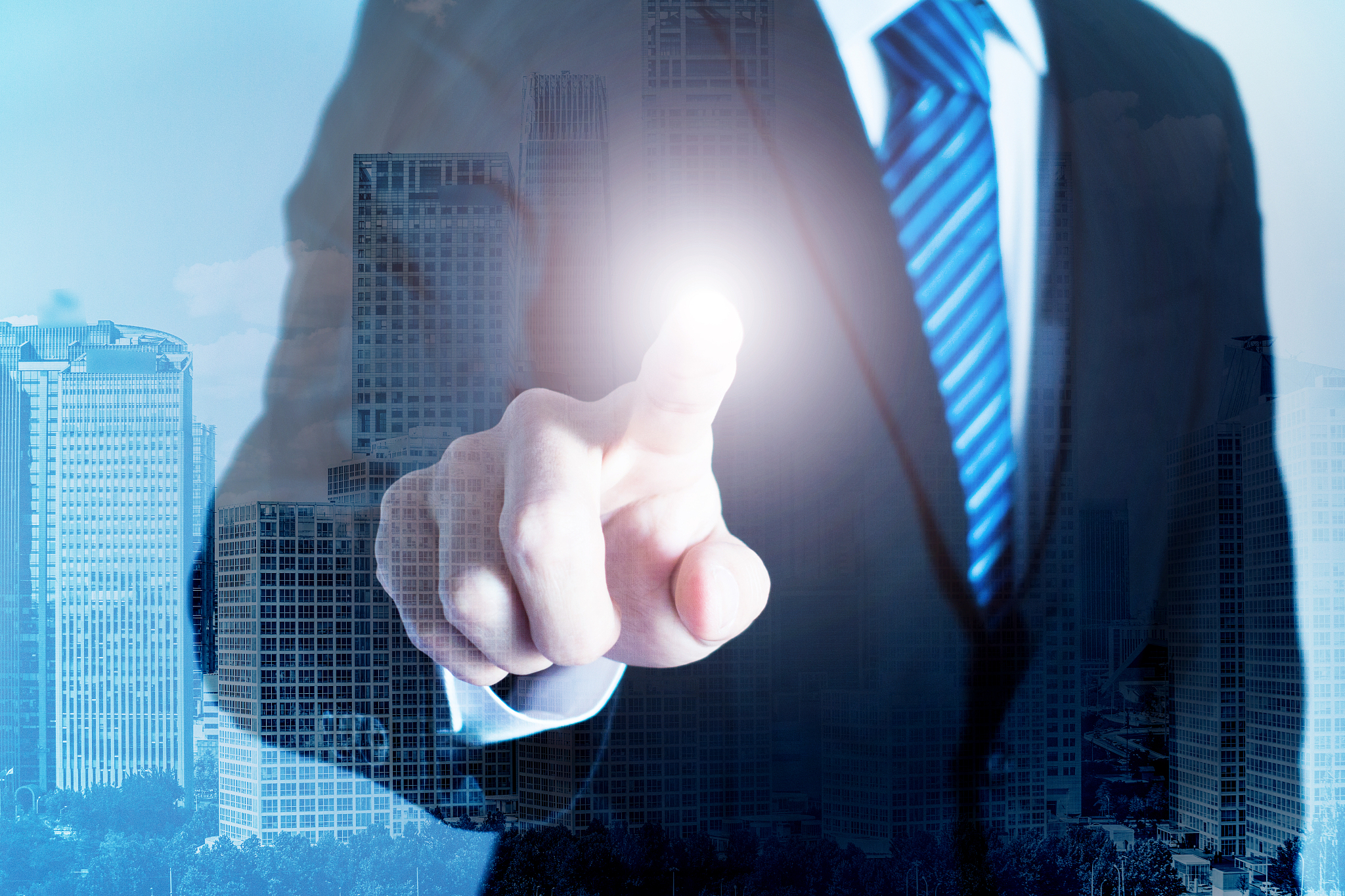 city double exposure concept with businessman finger pointing