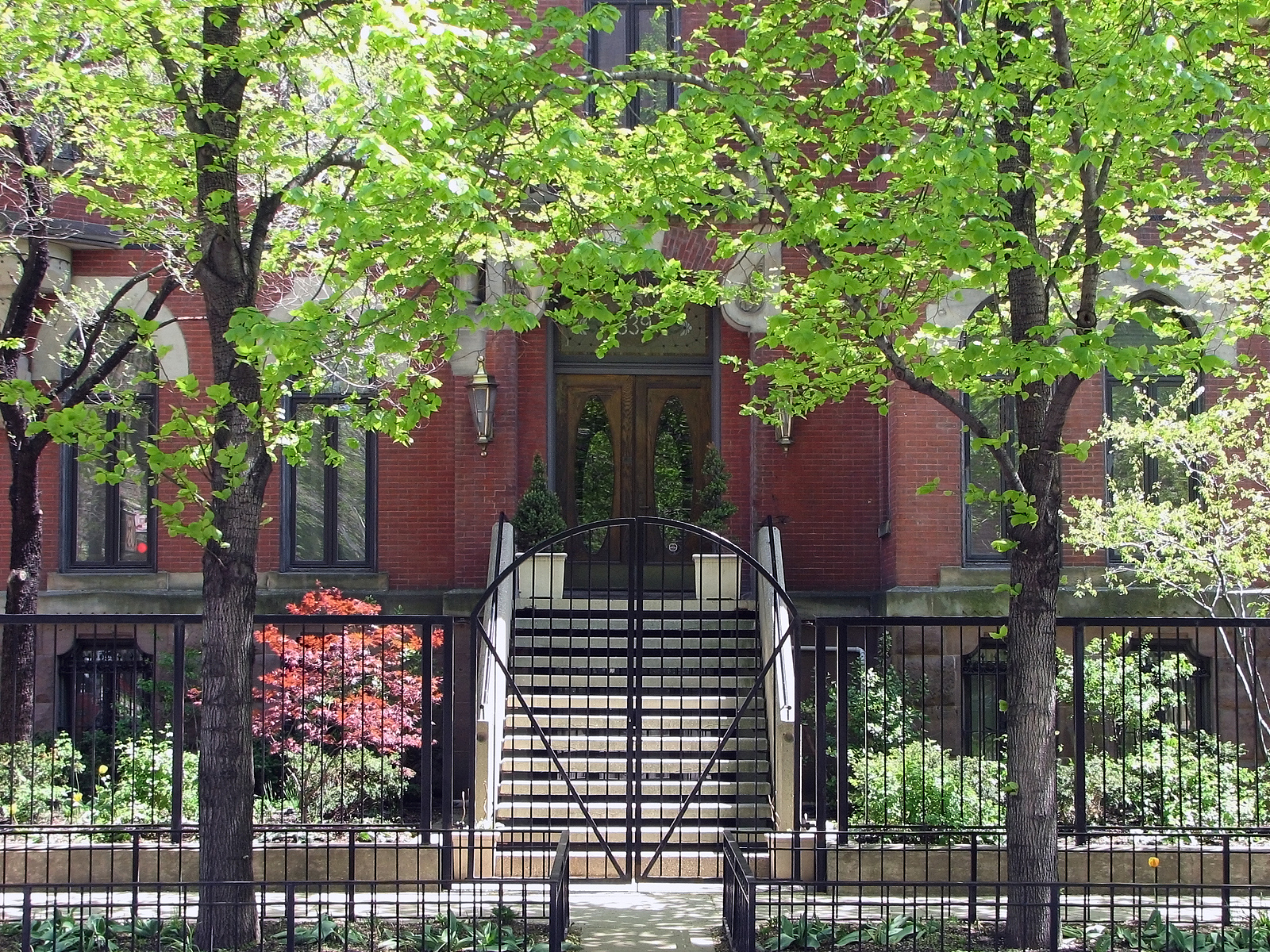 urban city home and lush landscaping